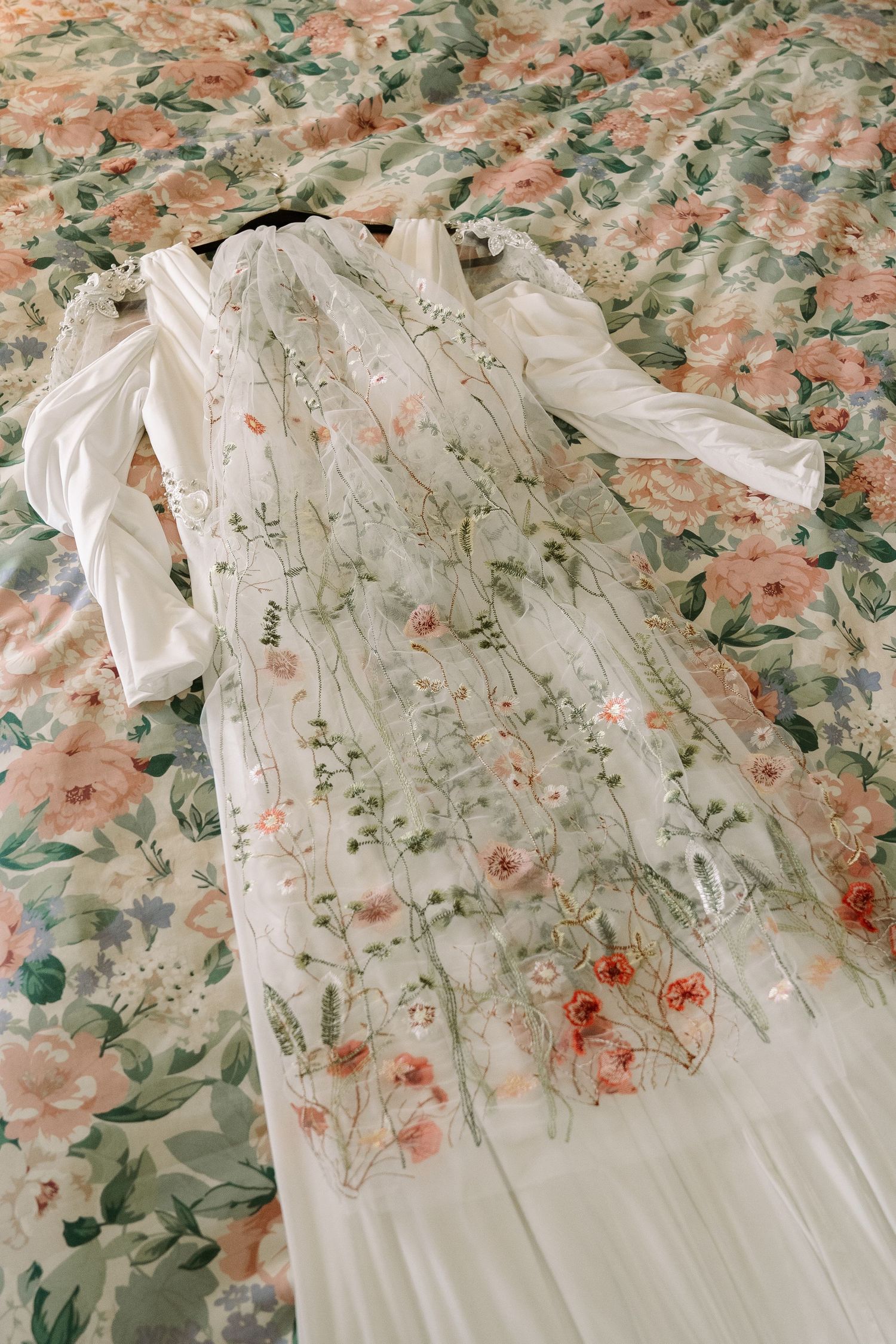 ©AnnaVonRiesenPhotography Wedding Photography | Color image of the dress on a bed.
