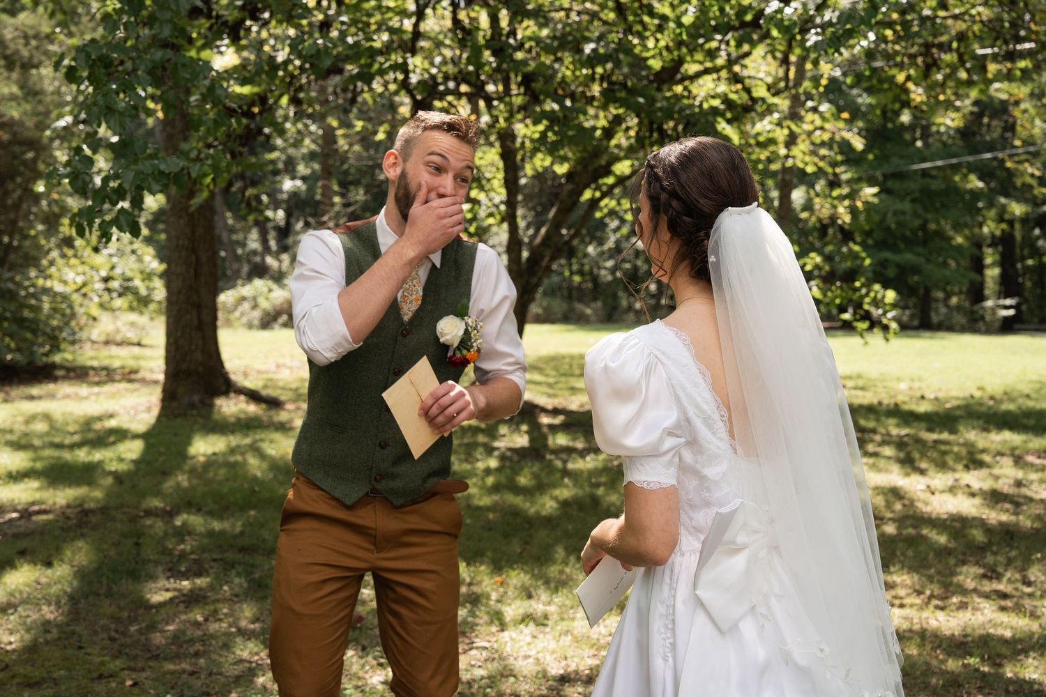 ©AnnaVonRiesenPhotography Wedding Photography | Color image of the groom reacting to his bride during their first look.