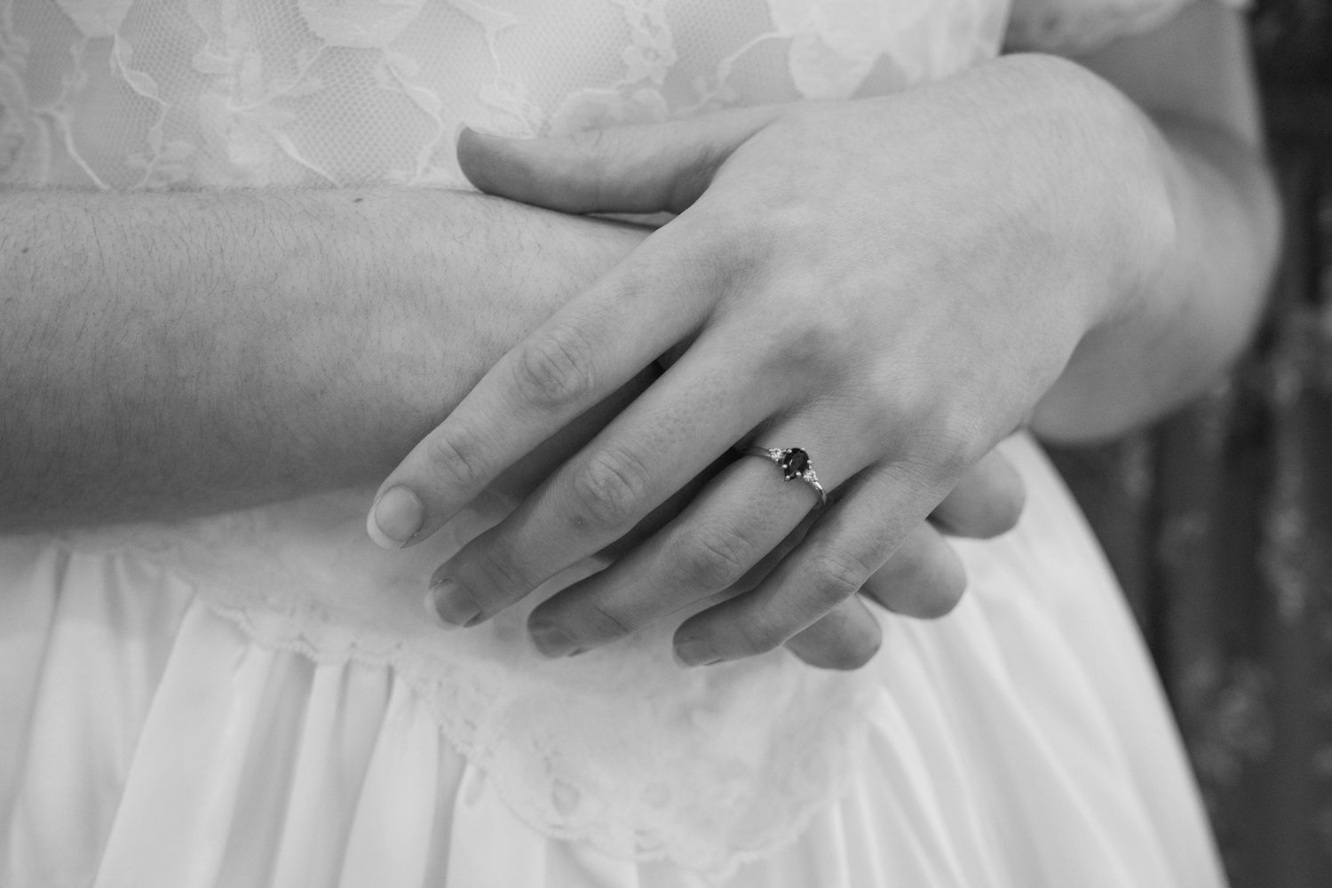©AnnaVonRiesenPhotography Wedding Photography | B&W image of the bride holding her hands, showing off her ring.