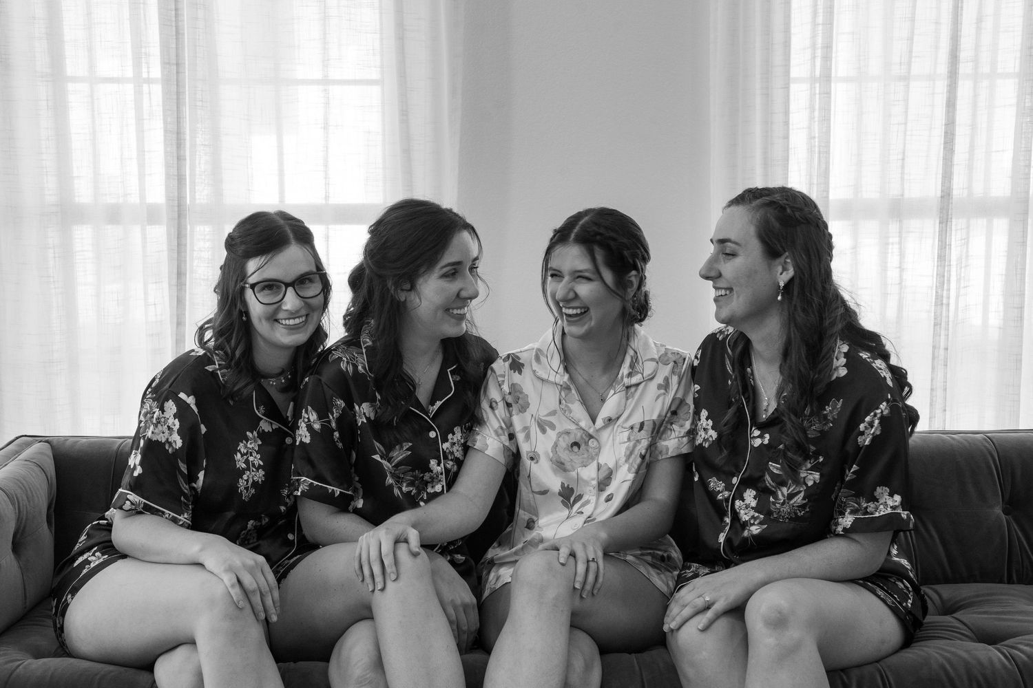 ©AnnaVonRiesenPhotography Wedding Photography | B&W image of the bride laughing with her sisters.