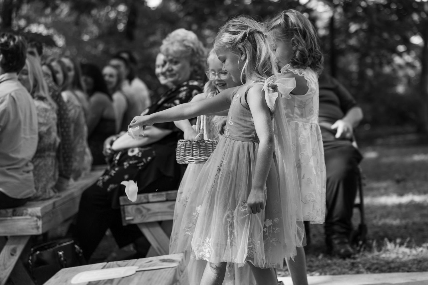 ©AnnaVonRiesenPhotography Wedding Photography | B&W image of the flower girls dropping the flower petals.