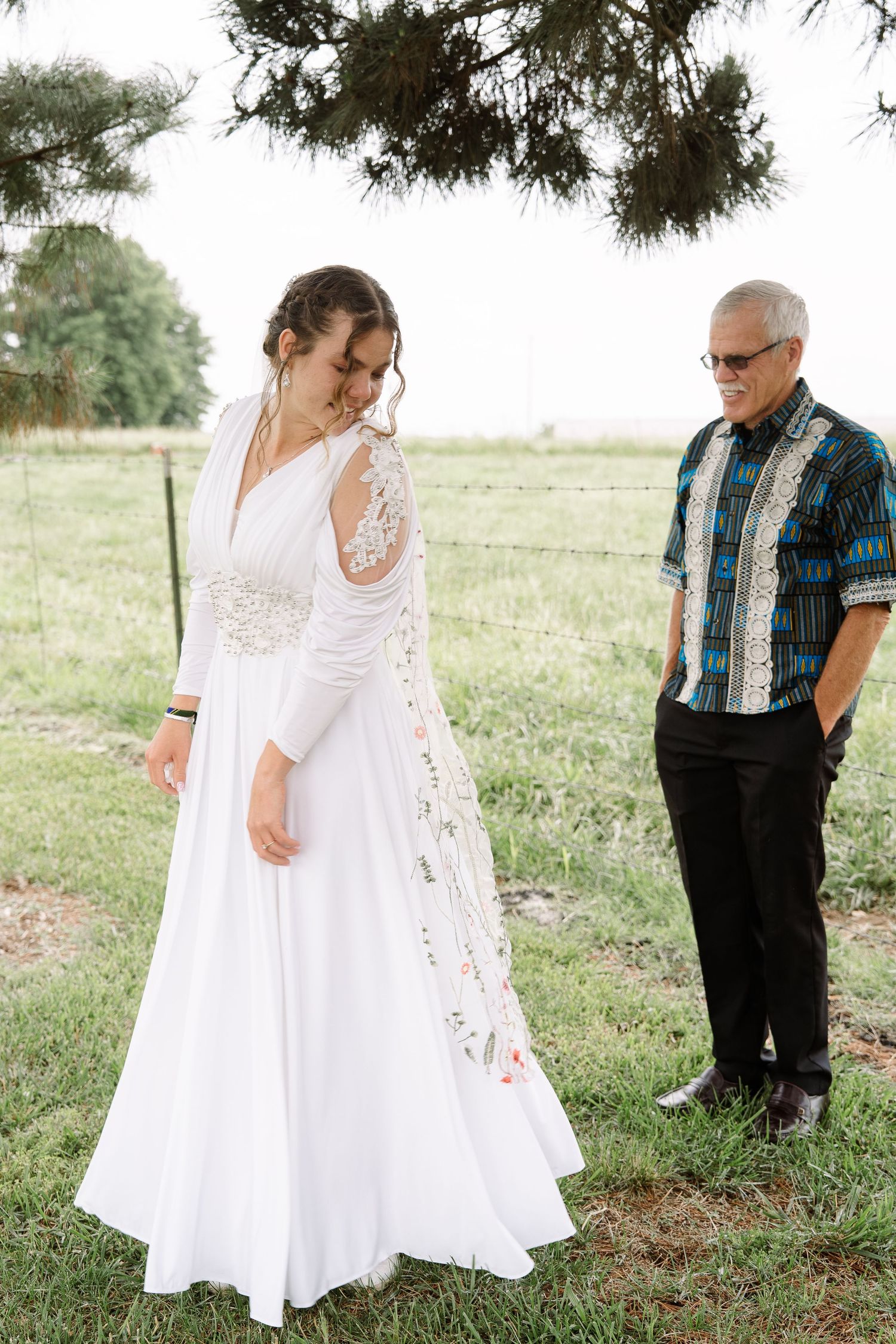 ©AnnaVonRiesenPhotography Wedding Photography | Color image of the bride showing her father her dress.