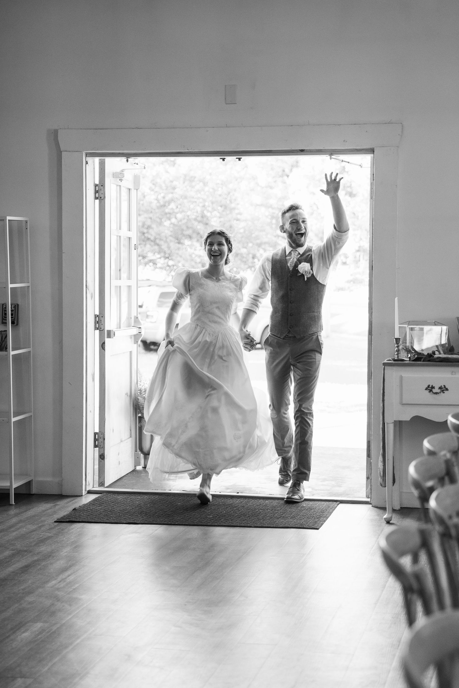 ©AnnaVonRiesenPhotography Wedding Photography | B&W image of the bride and groom making their grand entrance.