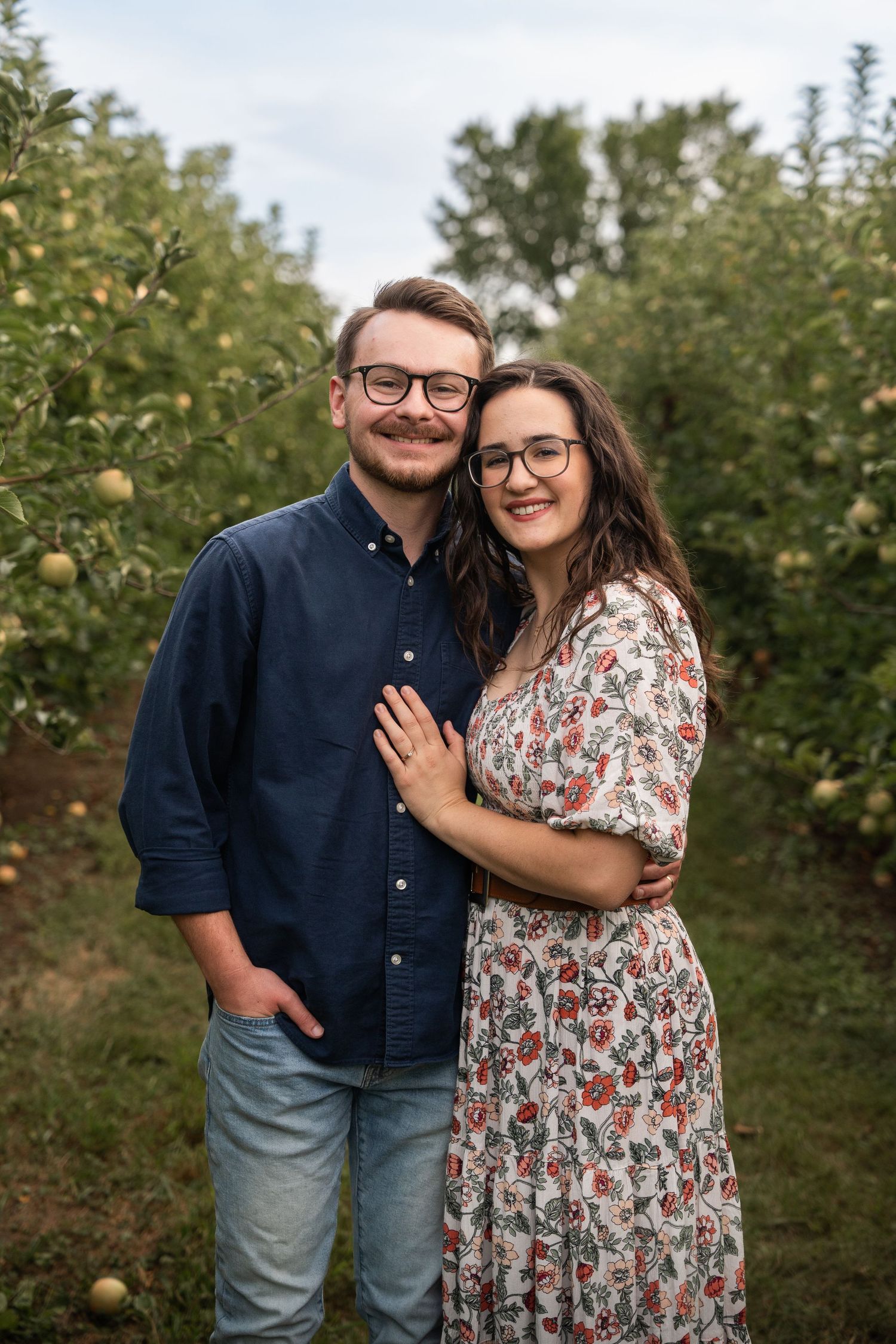 ©AnnaVonRiesenPhotography Couples Photography | Color image of a couple smiling and holding eachother.