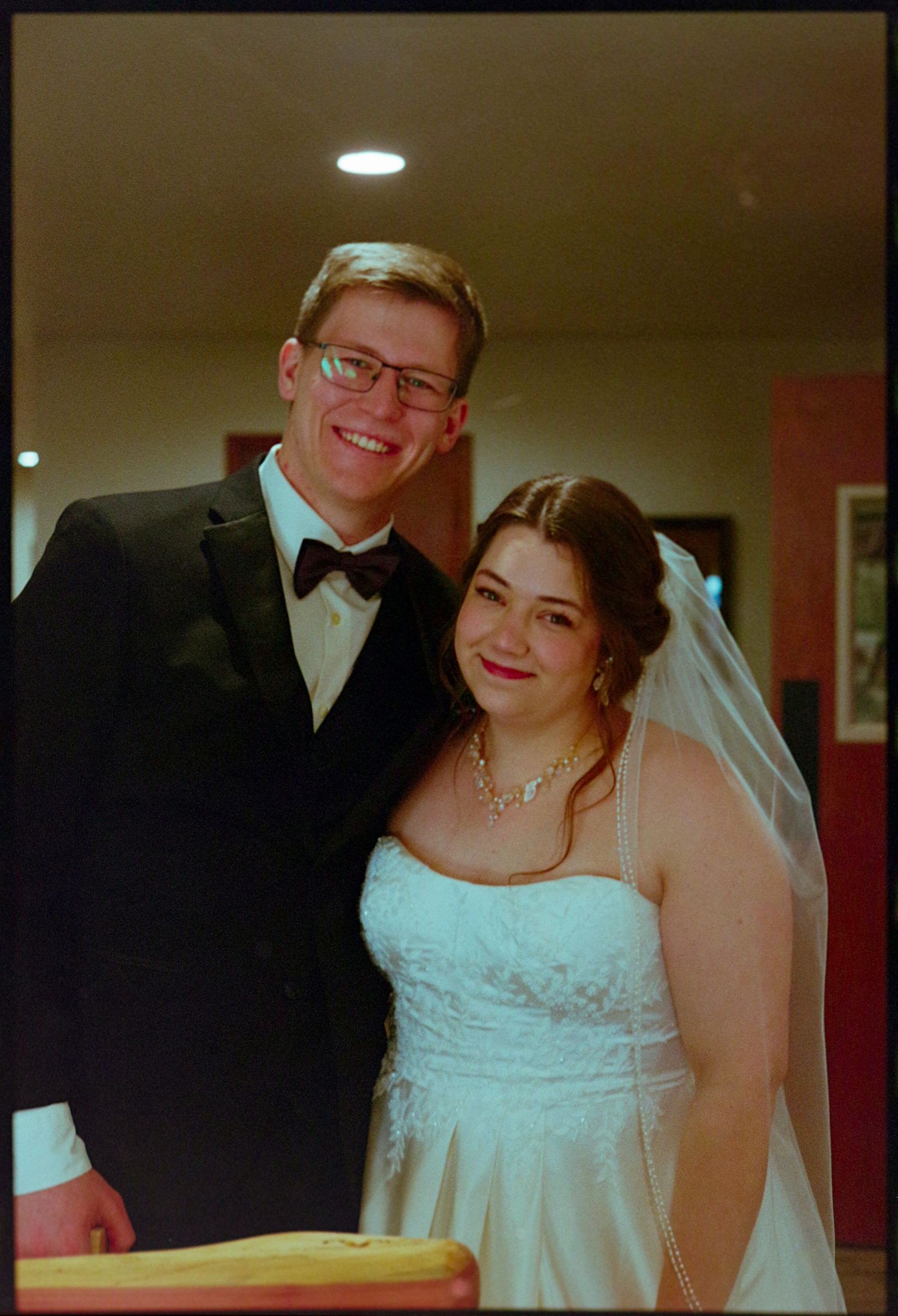 ©AnnaVonRiesenPhotography Wedding Photography | Film Color image of the bride & groom smiling together.