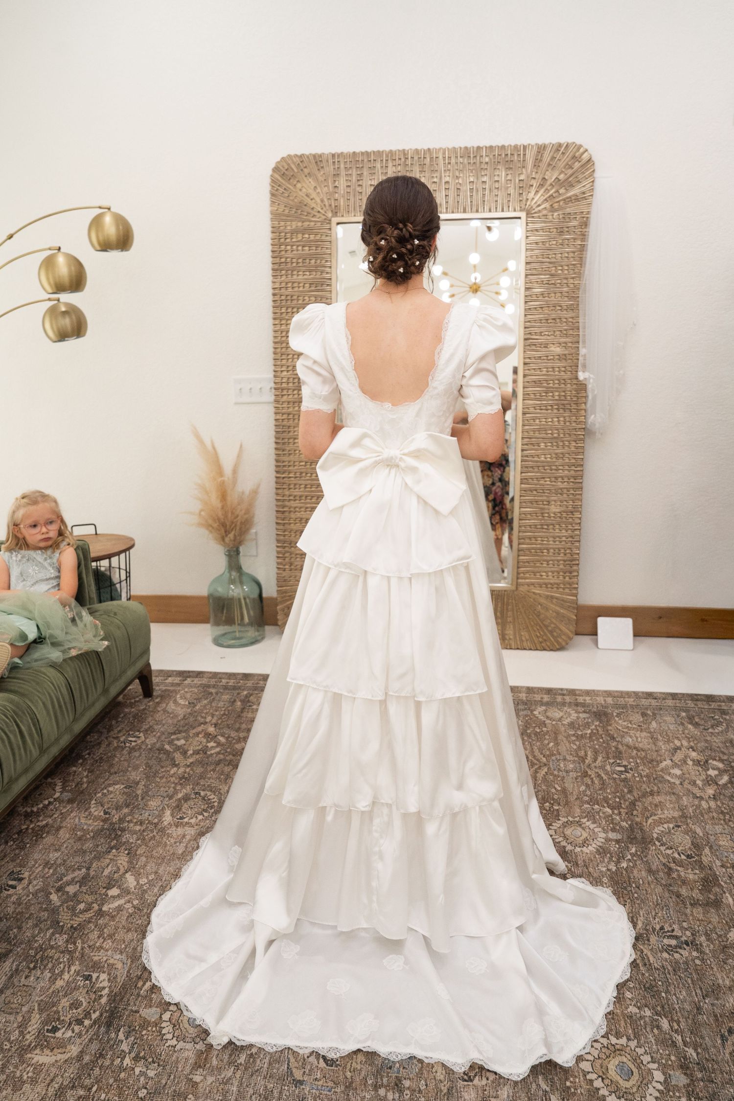 ©AnnaVonRiesenPhotography Wedding Photography | Color image of the bride looking at herself in a mirror.