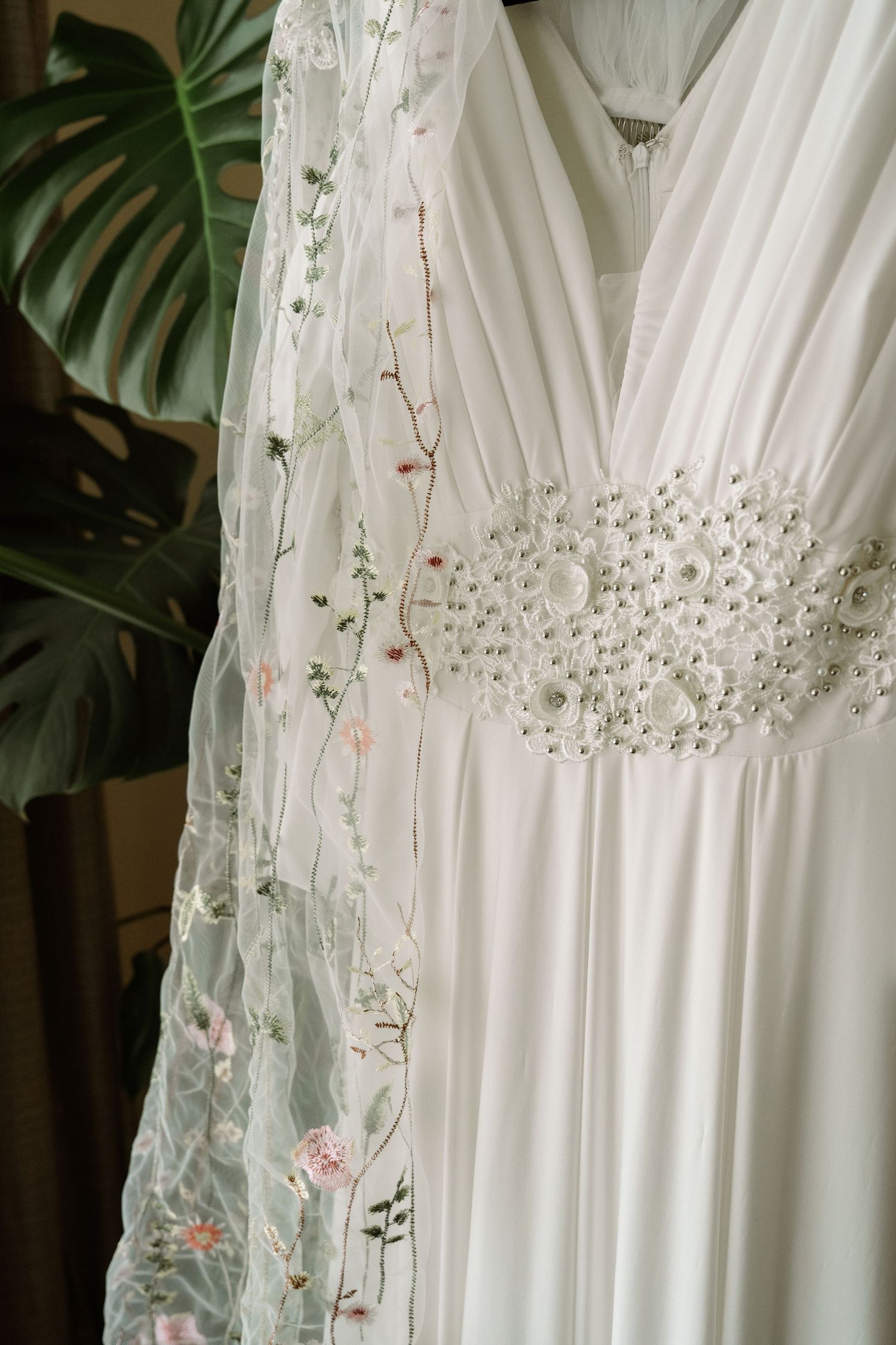 ©AnnaVonRiesenPhotography Wedding Photography | Color image of a wedding dress with its veil.
