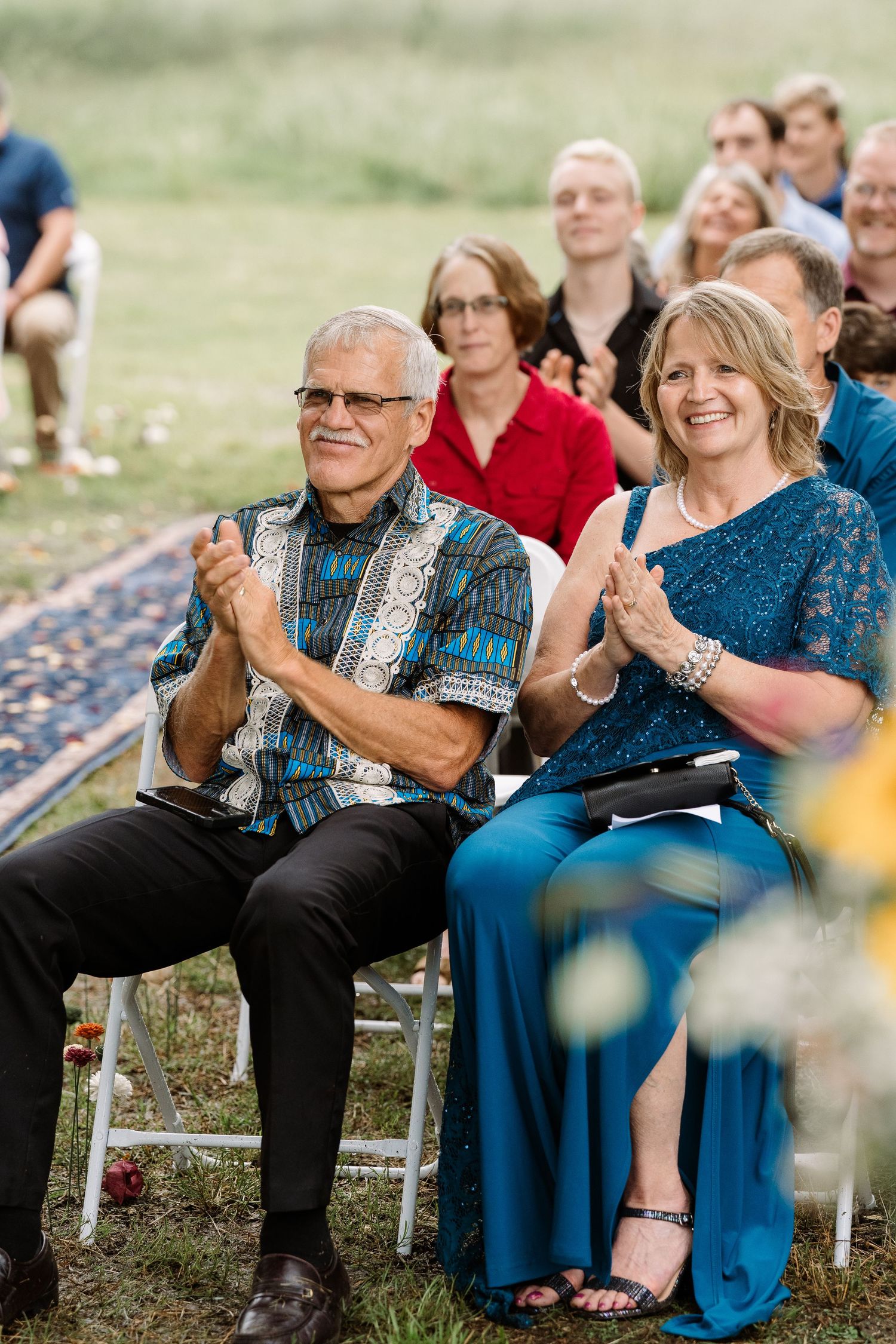 ©AnnaVonRiesenPhotography Wedding Photography | Color image of the bride's parents during the ceremony.