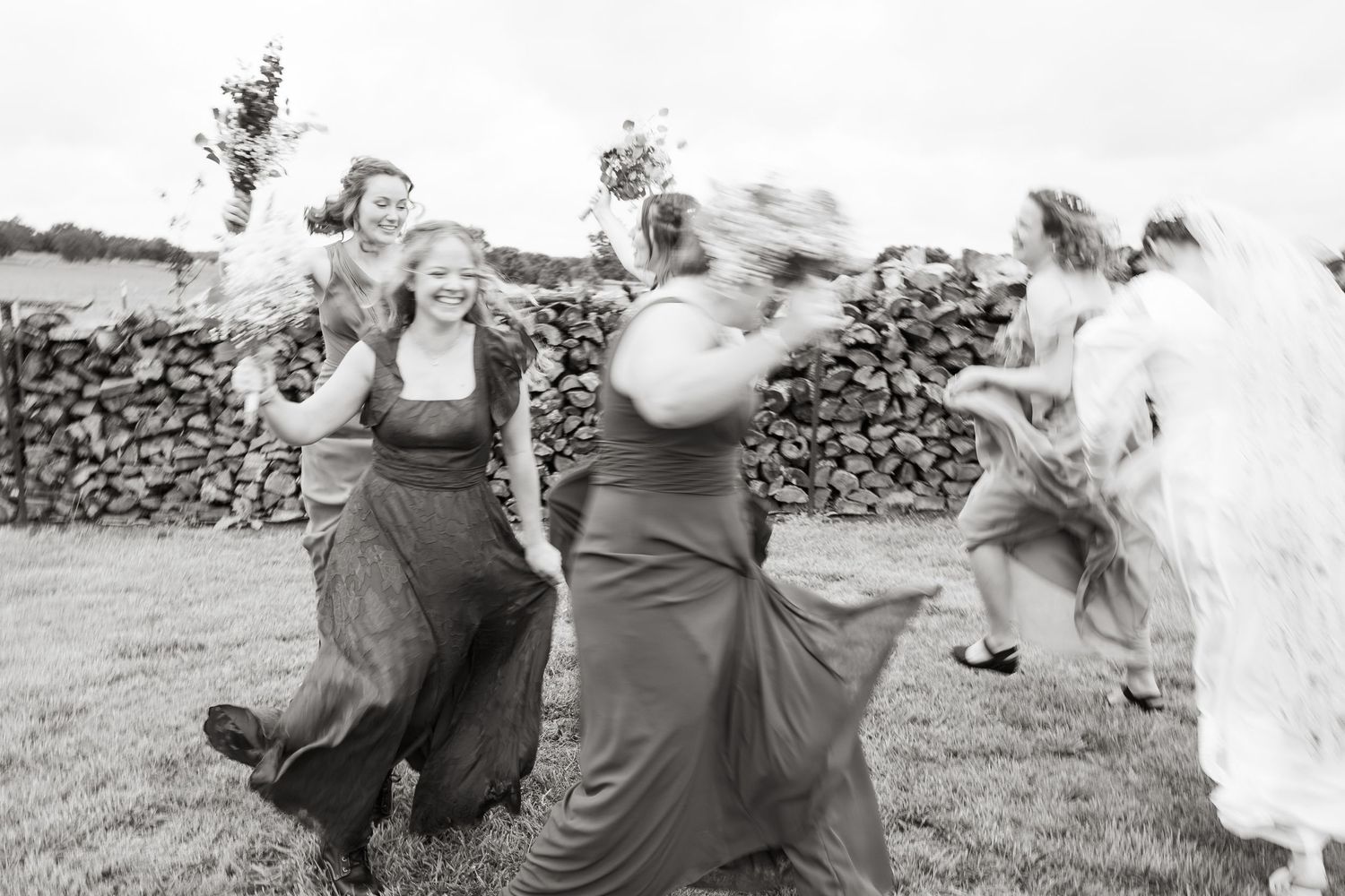 ©AnnaVonRiesenPhotography Wedding Photography | B&W image of the bridesmaids frollicking in a circle.