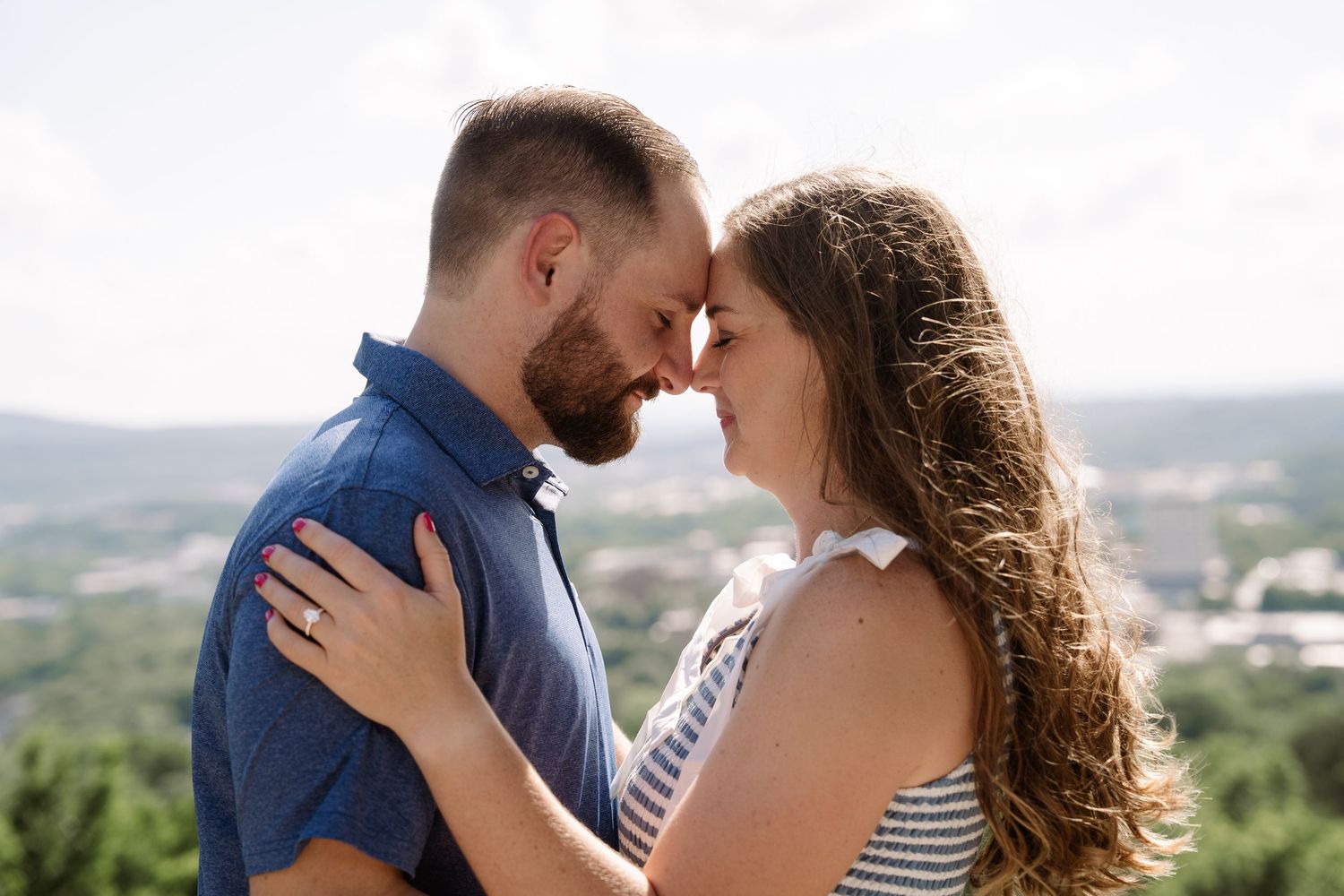 ©AnnaVonRiesenPhotography Engagement Photography | Color image of a couple touching foreheads.