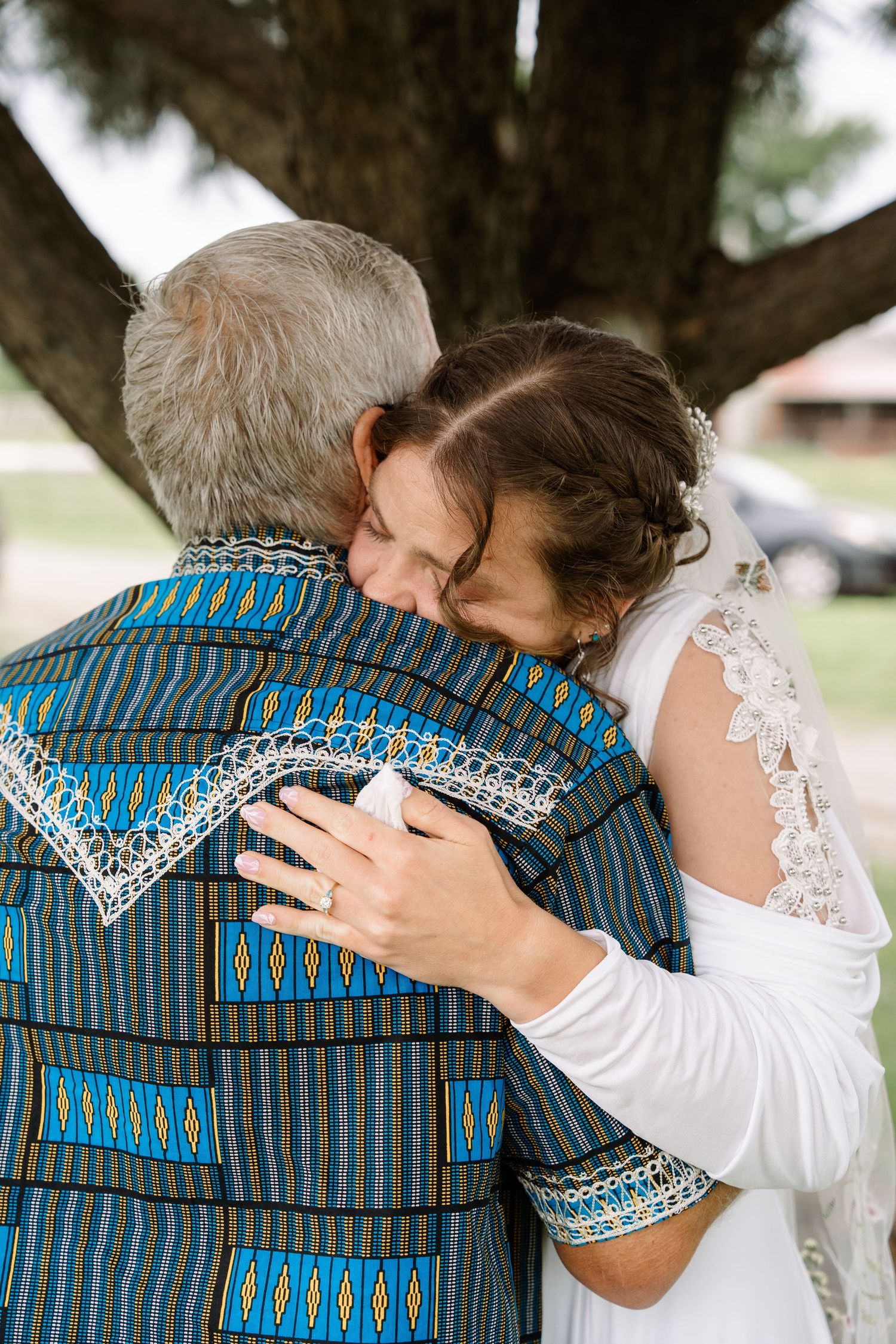 ©AnnaVonRiesenPhotography Wedding Photography | Color image of the bride hugging her father.
