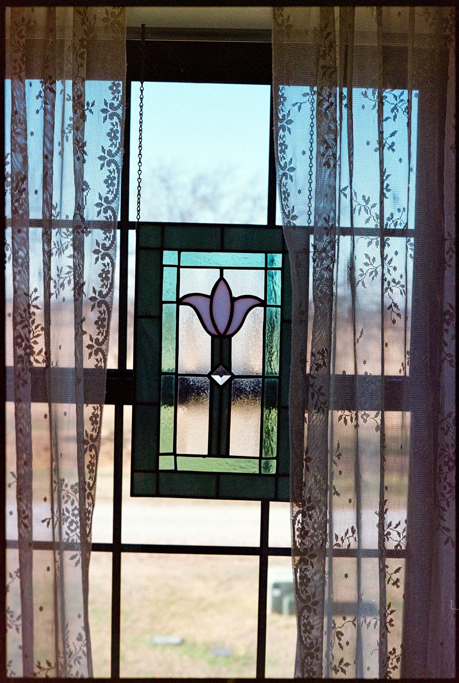 ©AnnaVonRiesenPhotography Wedding Photography | Film Color image of a stained glass window.