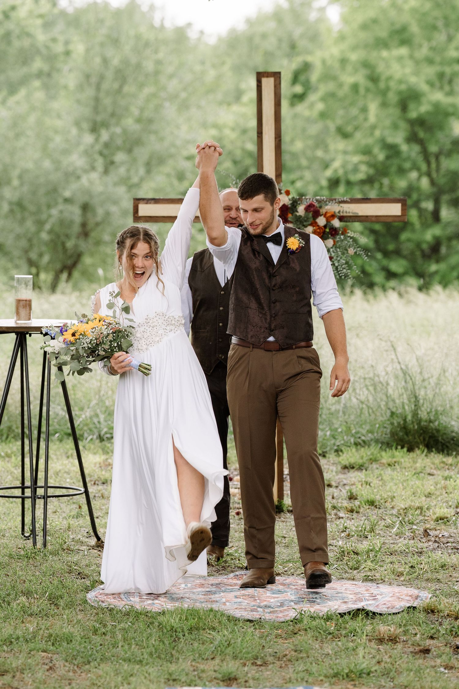 ©AnnaVonRiesenPhotography Wedding Photography | Color image of the bride & groom cheering after the kiss.