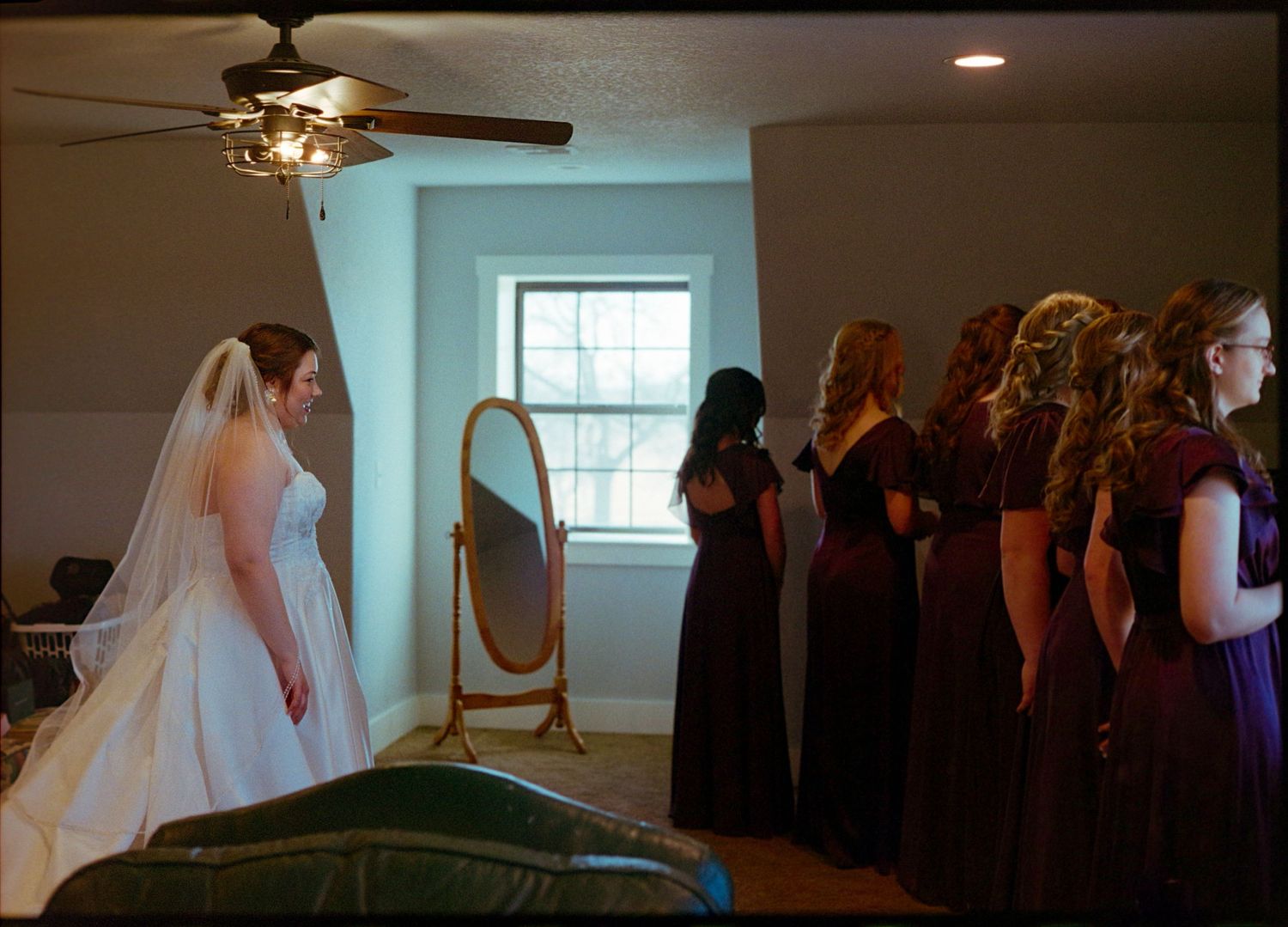 ©AnnaVonRiesenPhotography Wedding Photography | Film Color image of the bride waiting for her bridesmaids to turn around.