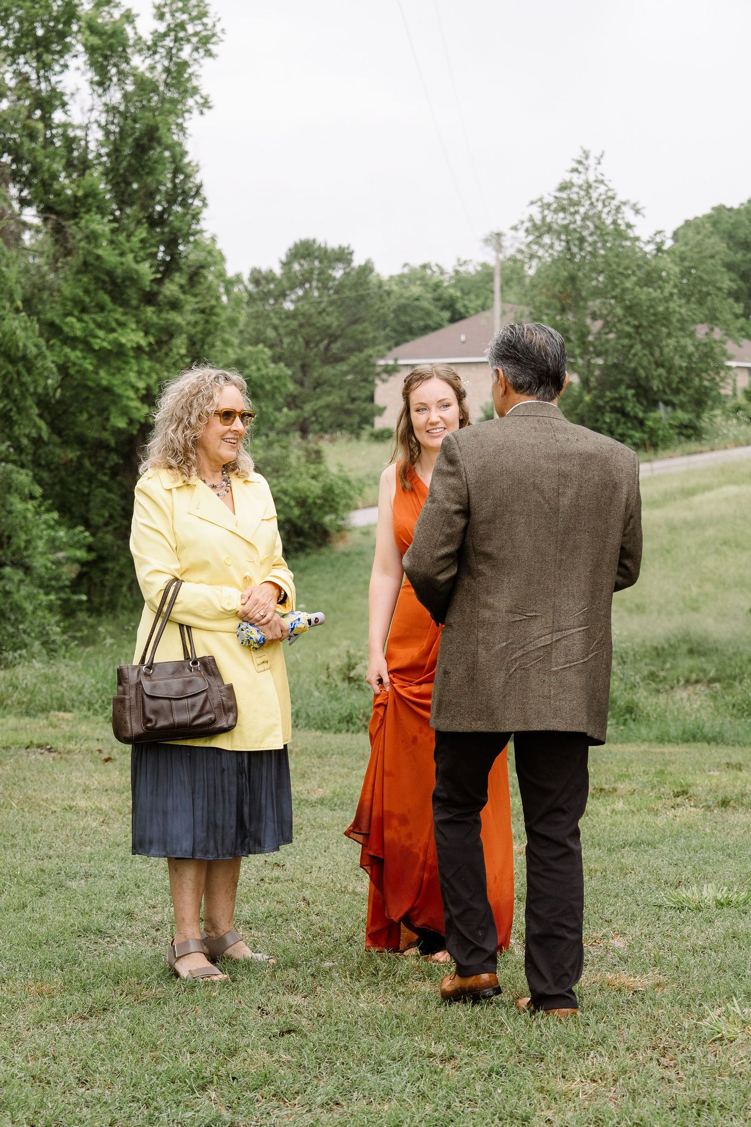 ©AnnaVonRiesenPhotography Wedding Photography | Color image of wedding guests talking together.