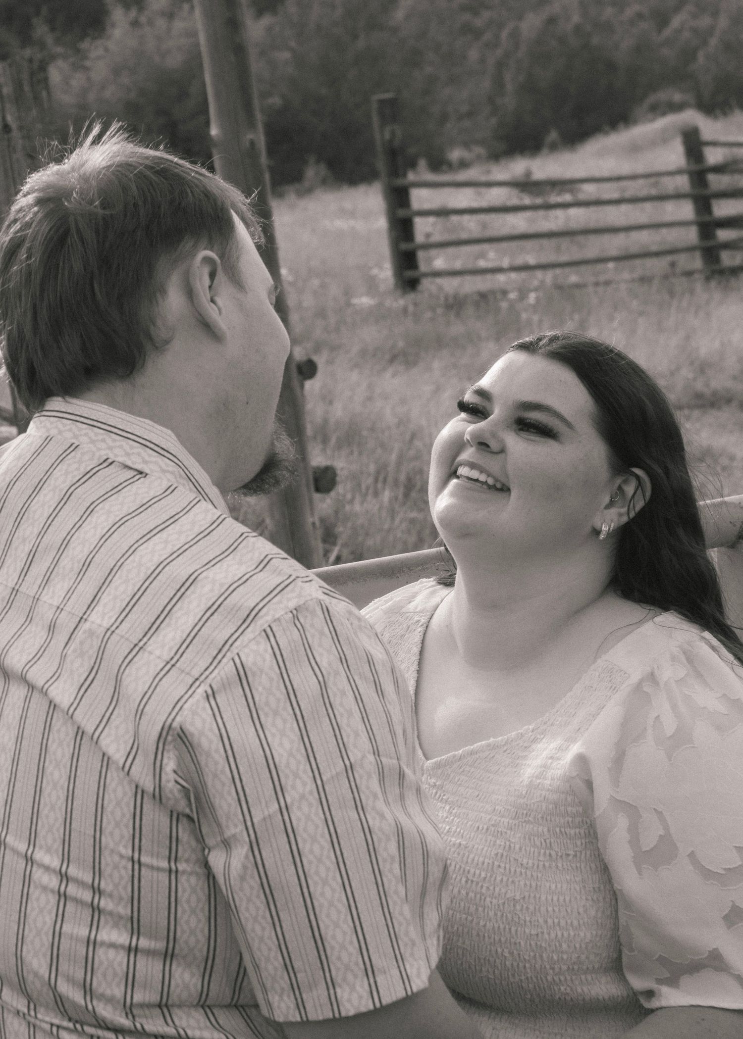 Couple laughing together in flower field canyon ceremony