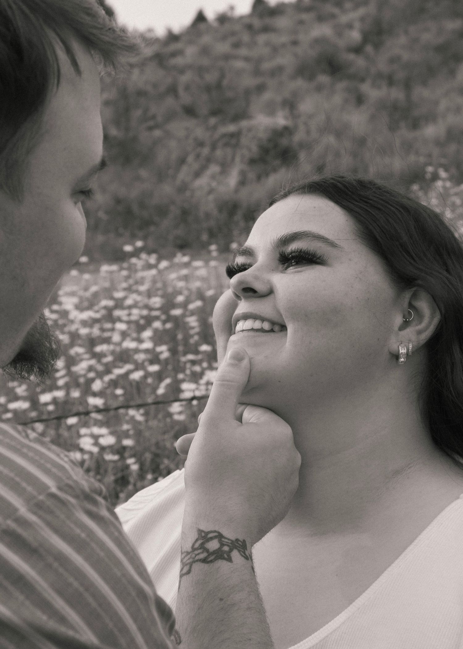 Couple during flower field engagement photos