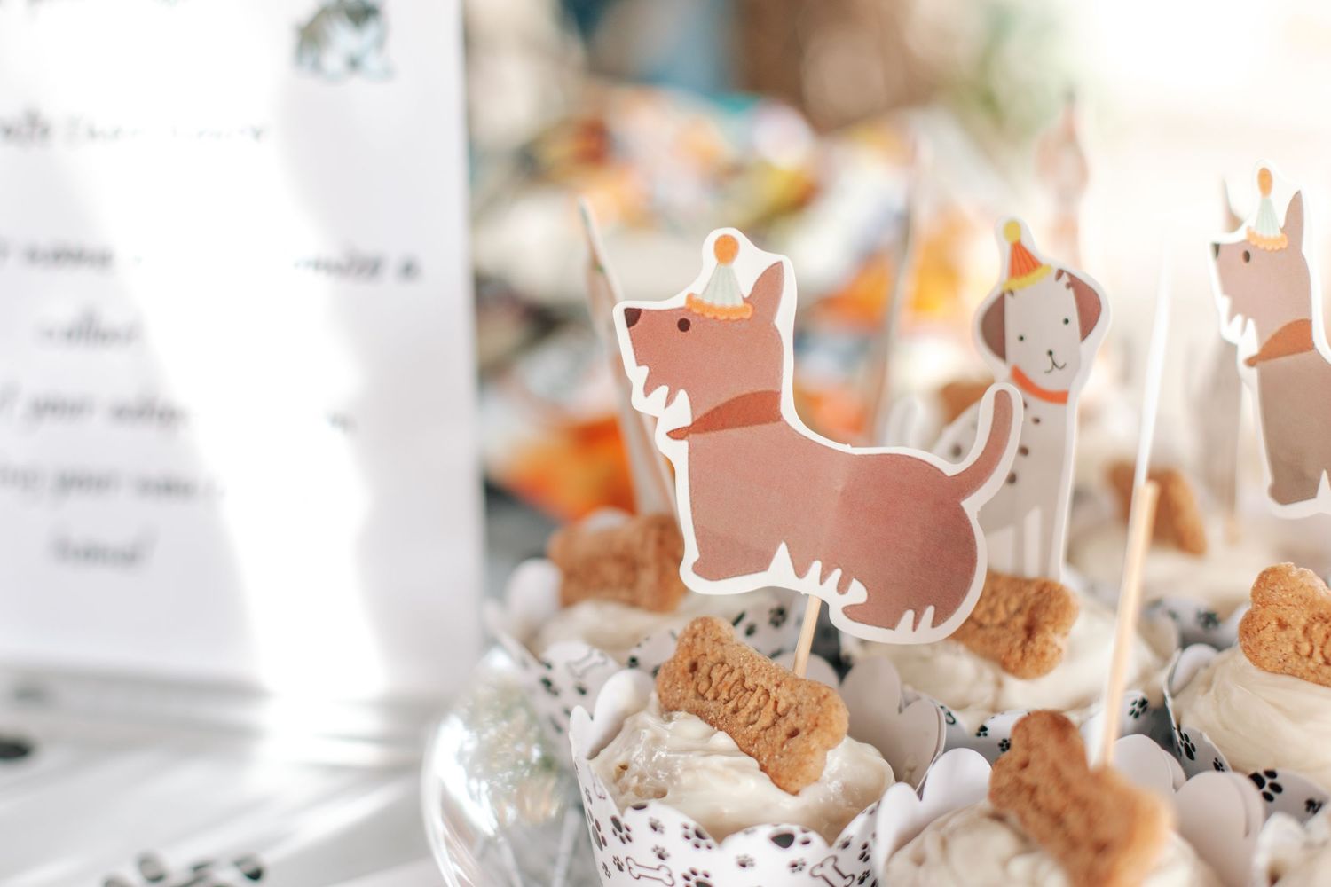 Adorable dog-themed cupcakes with cute puppy toppers at a festive birthday party.