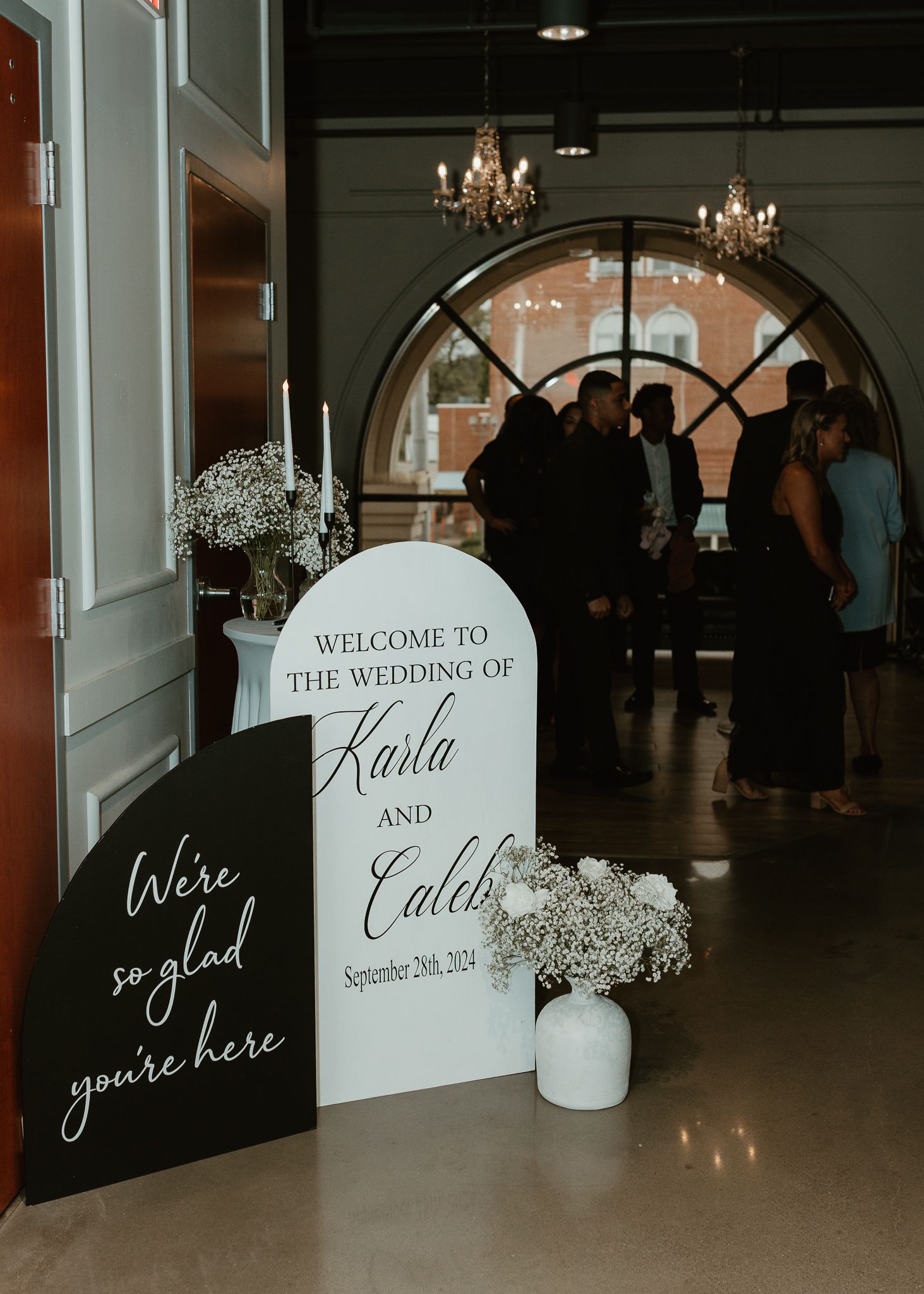 Wedding welcome signs with elegant script lettering and floral decorations.