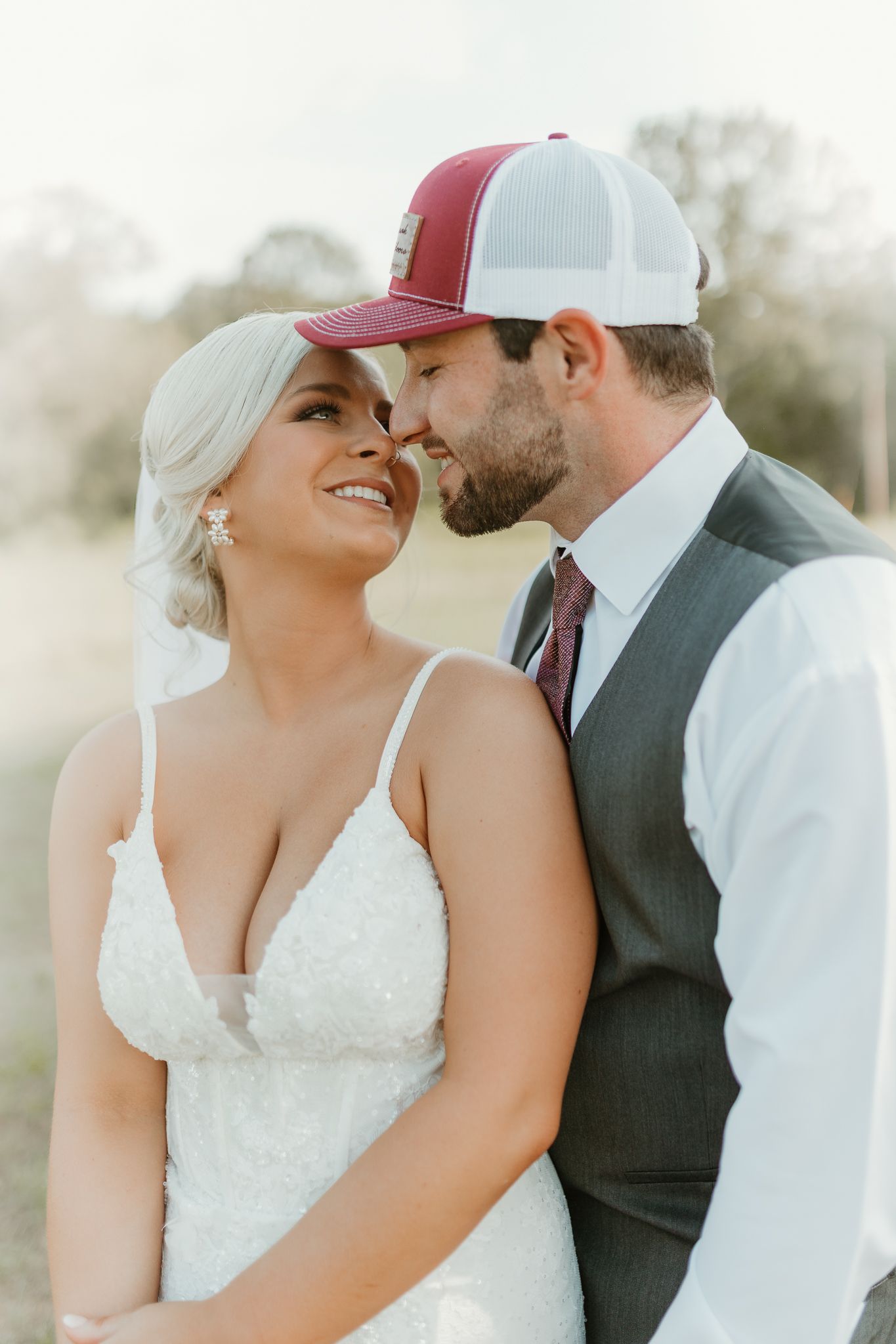Romantic wedding portraits showing tender moments between a couple wearing casual and formal attire.