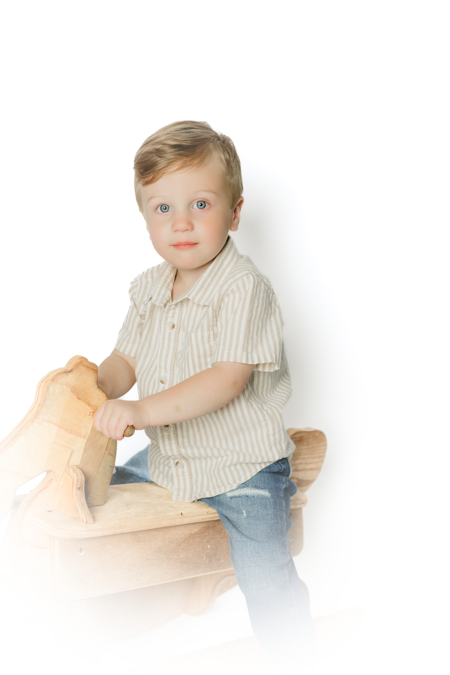 Candid shots of a toddler playing while wearing a striped button-down shirt.