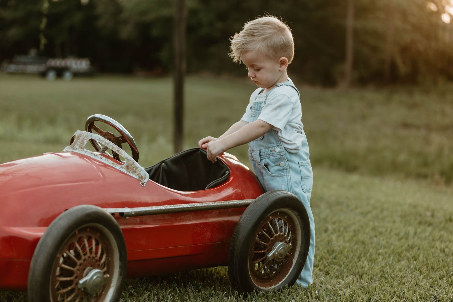 Vintage-style photo series of a child playing with a red pedal car in a grassy field at sunset.