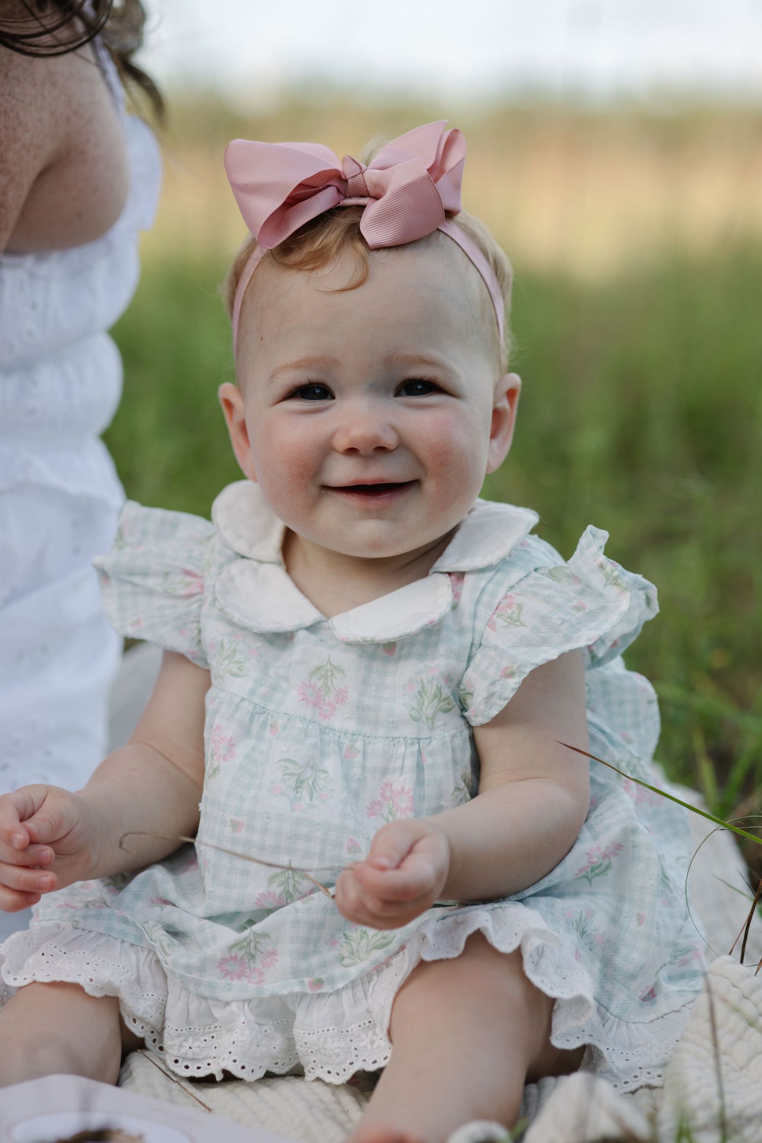 Mom and baby during a sunset motherhood portrait session in Okeechobee, Florida capturing a tender moment