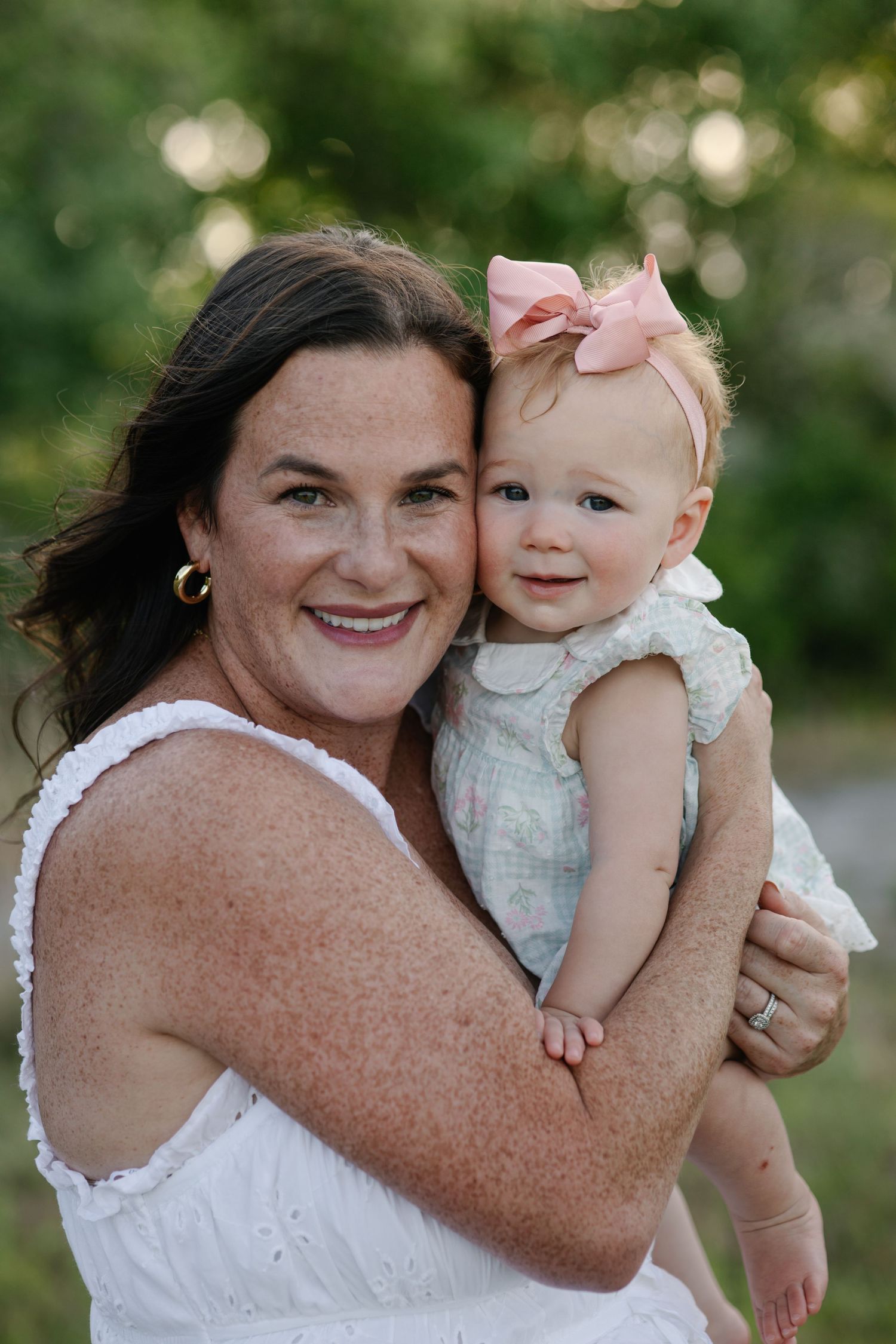 Mom and baby during a sunset motherhood portrait session in Okeechobee, Florida capturing a tender moment
