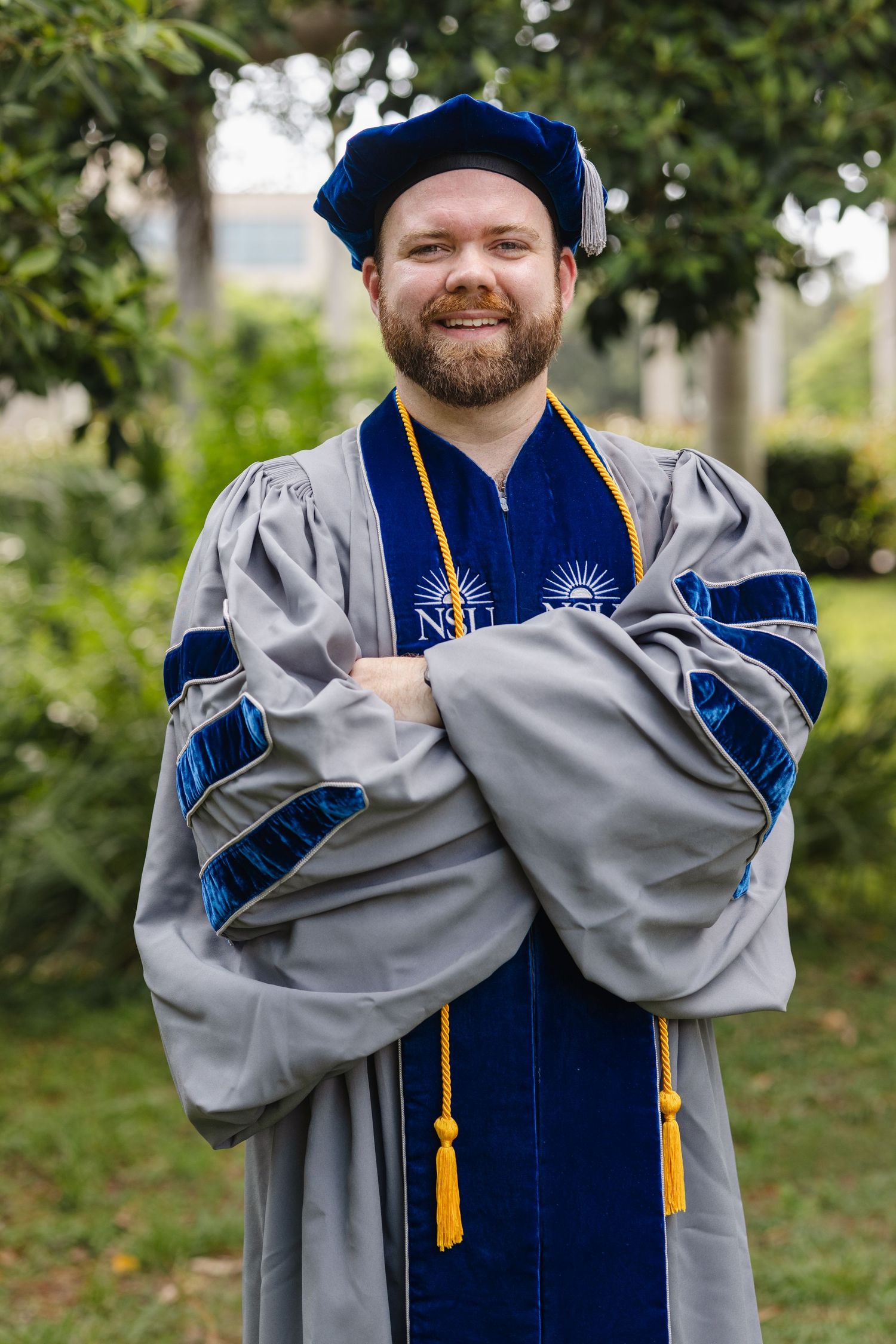 Nursing graduate photoshoot in Stuart, Florida featuring a graduate in cap and gown during a professional portrait session