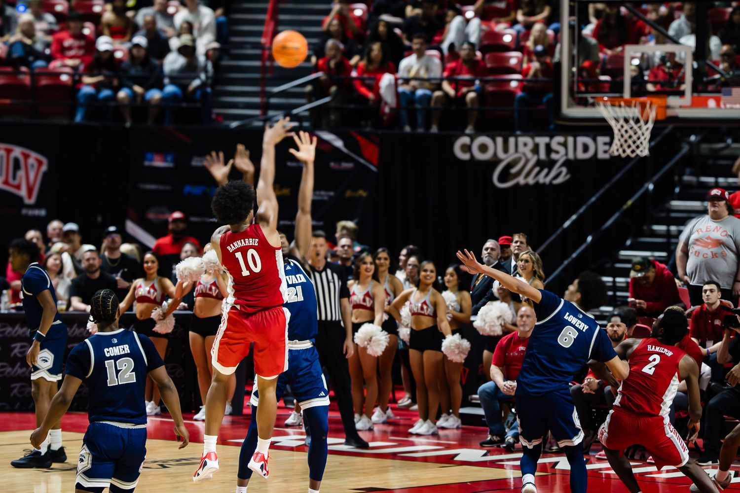 UNLV Runnin' Rebels basketball player #10 attempts a shot during an intense college basketball game at Thomas & Mack Center.