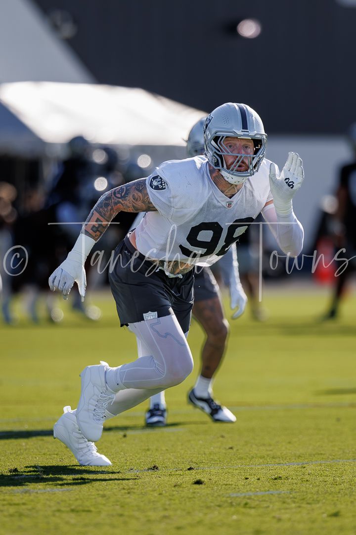 Las Vegas Raiders defensive end #98 rushes off the line during training camp practice.