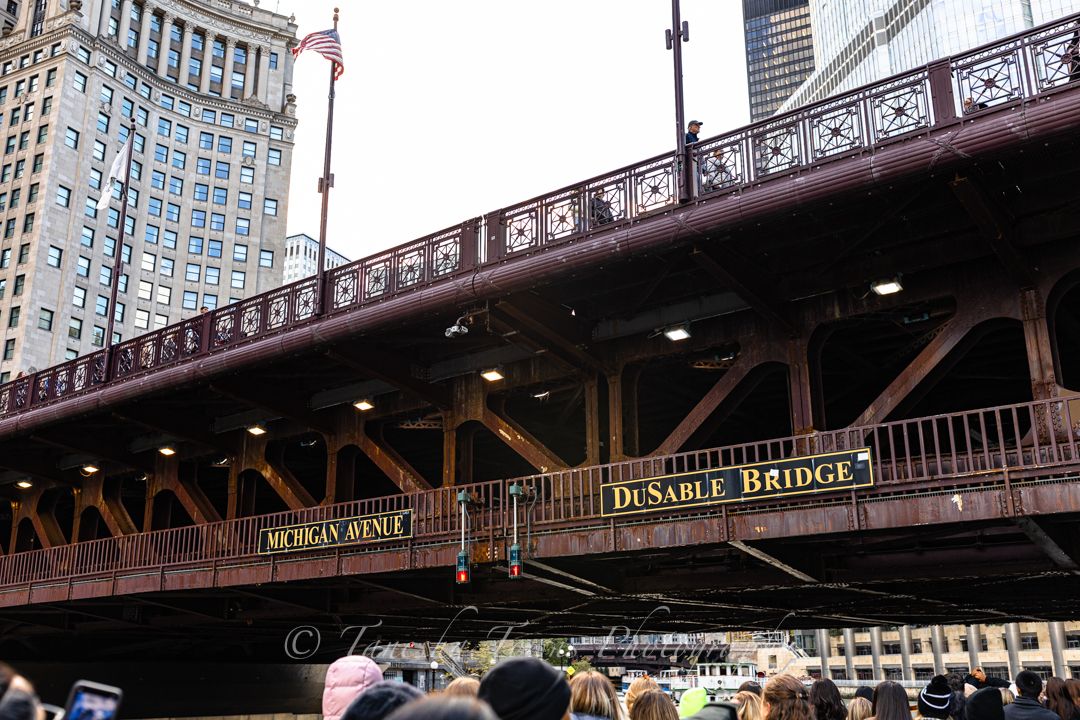 Panoramic view of Chicago's iconic DuSable Bridge with its ornate ironwork and architectural details spanning the river.
