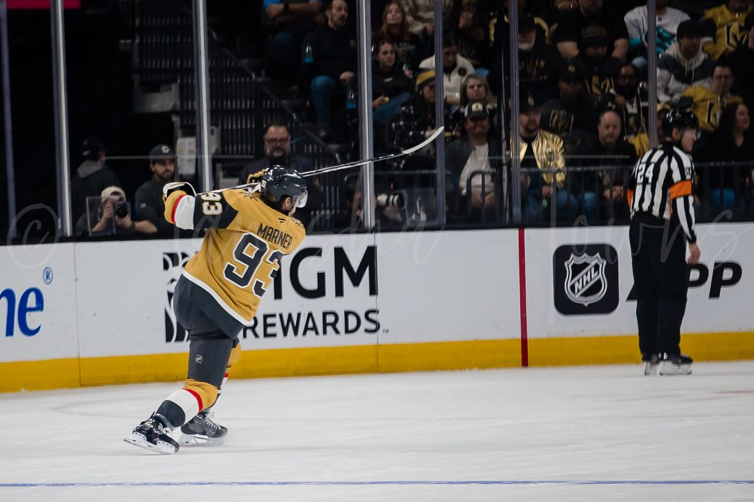 A Golden Knights player celebrates after scoring during an NHL game.
