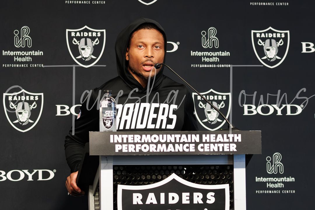 Raiders player speaks at Intermountain Health Performance Center podium during press conference.