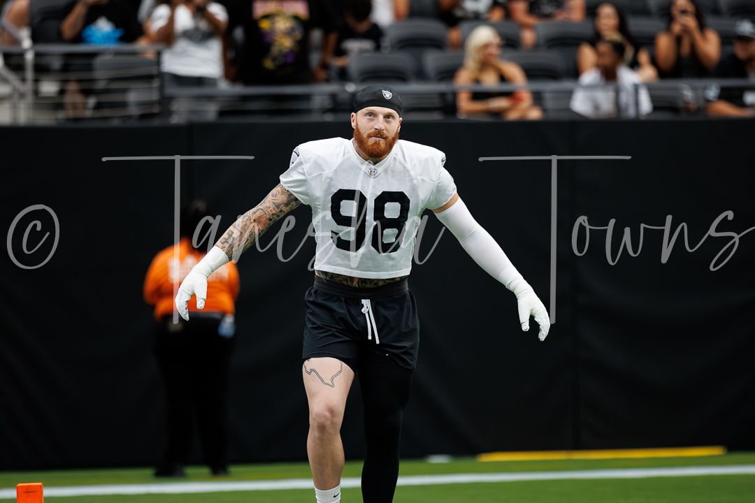 Las Vegas Raiders player #98 runs a drill during practice at Allegiant Stadium.