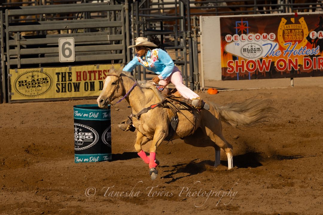 Fast-paced barrel racing competition sequence showing horse and rider completing course in dusty arena.