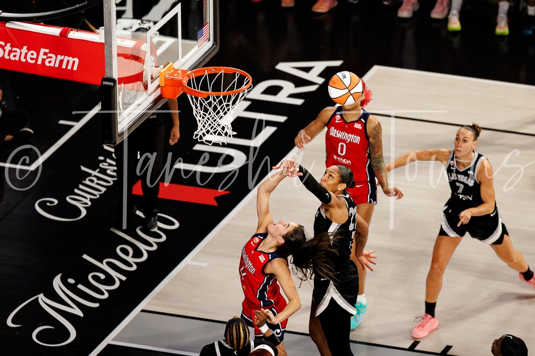 WNBA player drives to the basket during a Las Vegas Aces home game at Michelob Ultra Arena.
