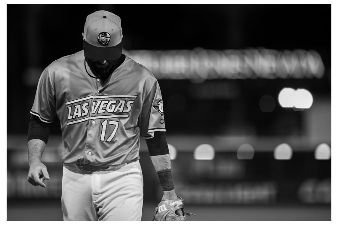 Black and white photo of Las Vegas baseball player #17 walking on field in uniform.
