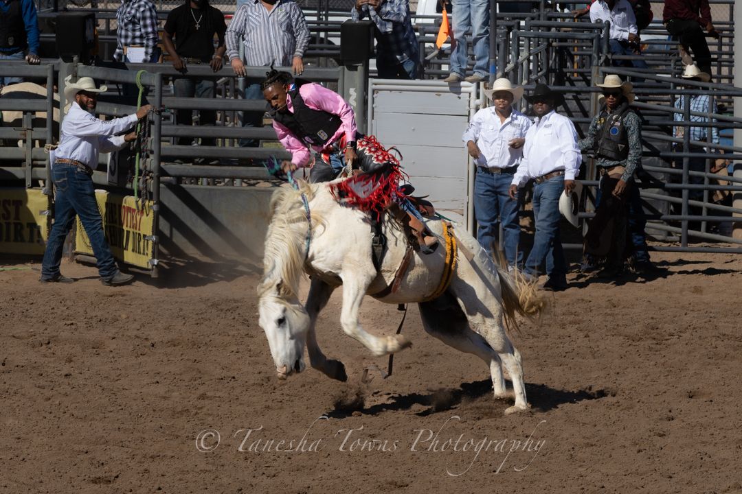 Sequence showing a rodeo rider being thrown from a bucking horse during a competition at a western arena.