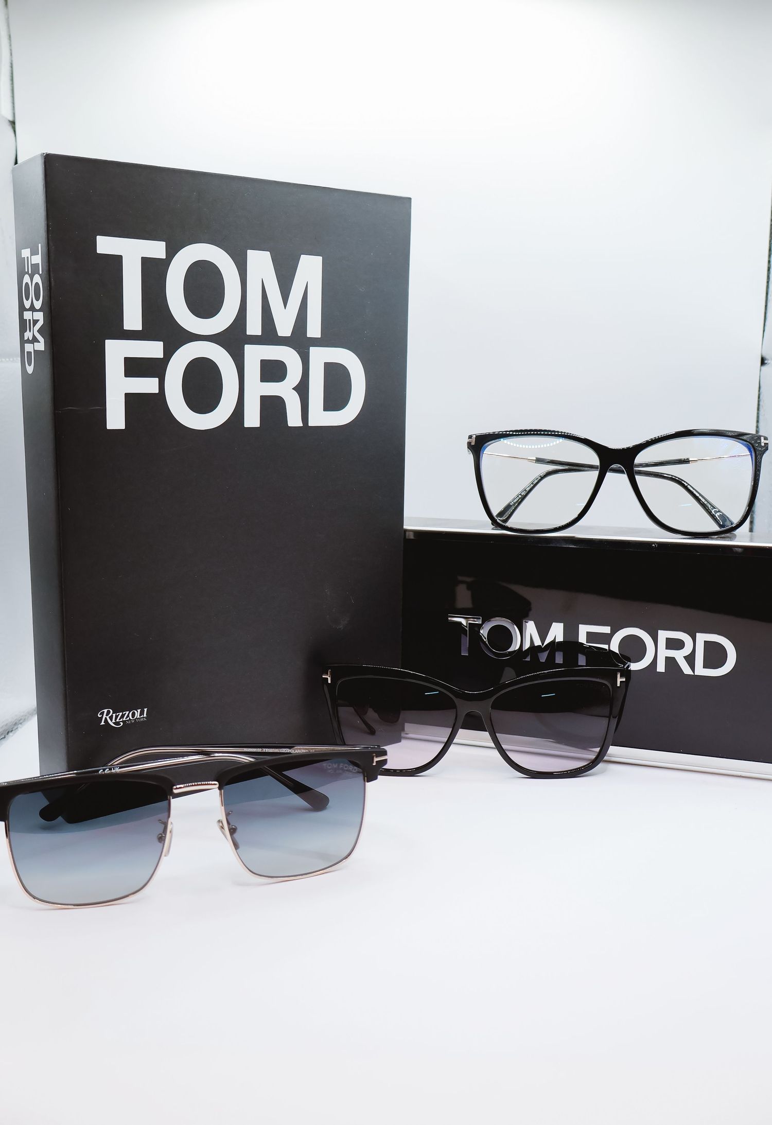 Tom Ford eyewear collection display with multiple eyeglass frames and branding.