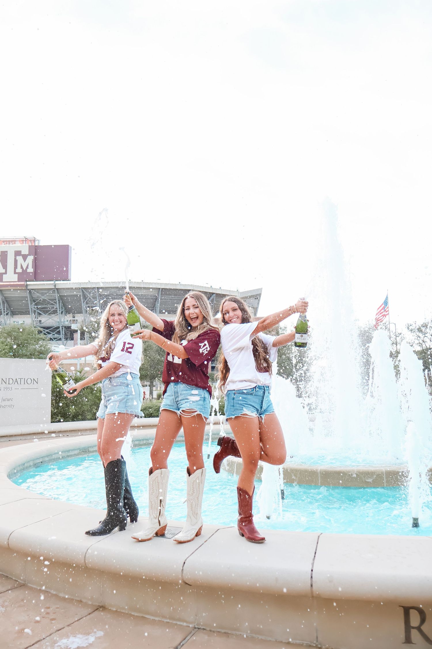 Group celebration photos at a campus fountain with boots and Texas A&M gear.