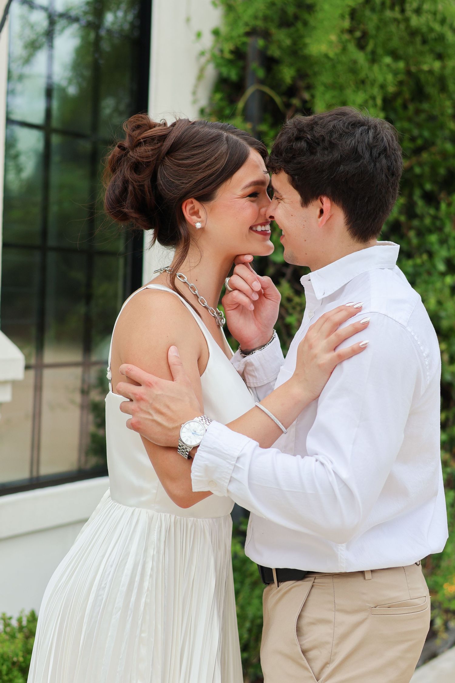 A couple in wedding attire share romantic moments in a series of candid outdoor photos.