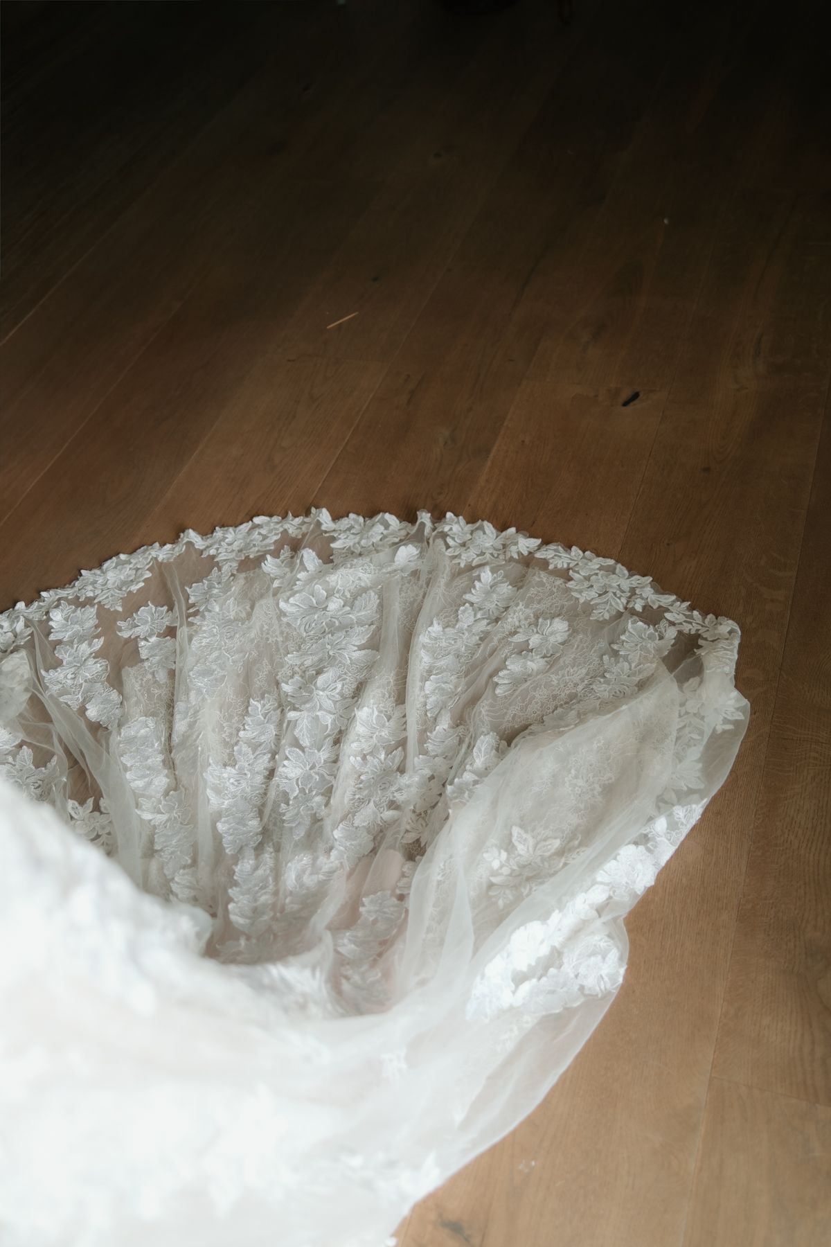A close-up sequence of white crystalline formations or icy structures against a dark wooden surface.