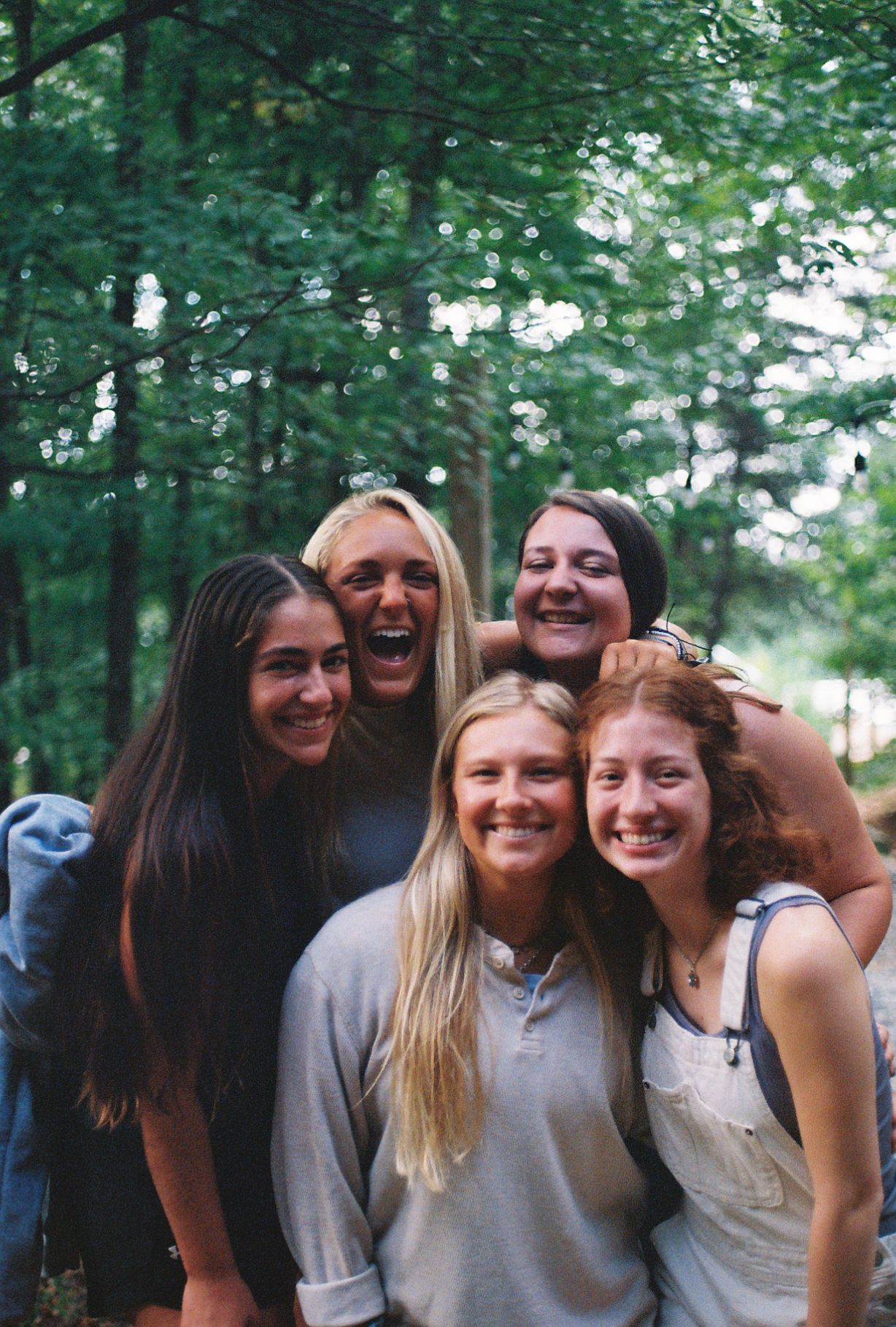 Group of 5 girls laughing and smiling