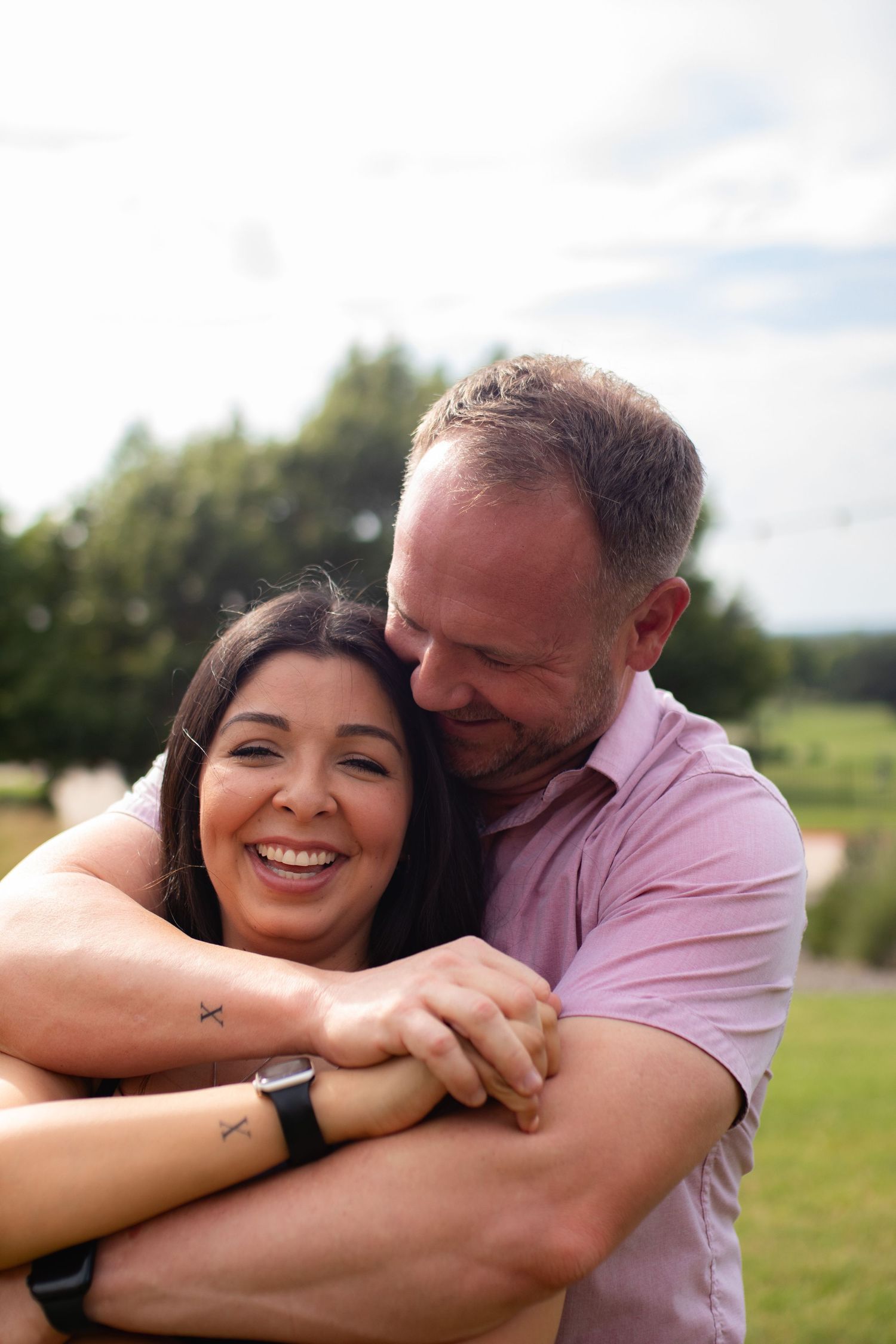 Man and woman embracing and smiling
