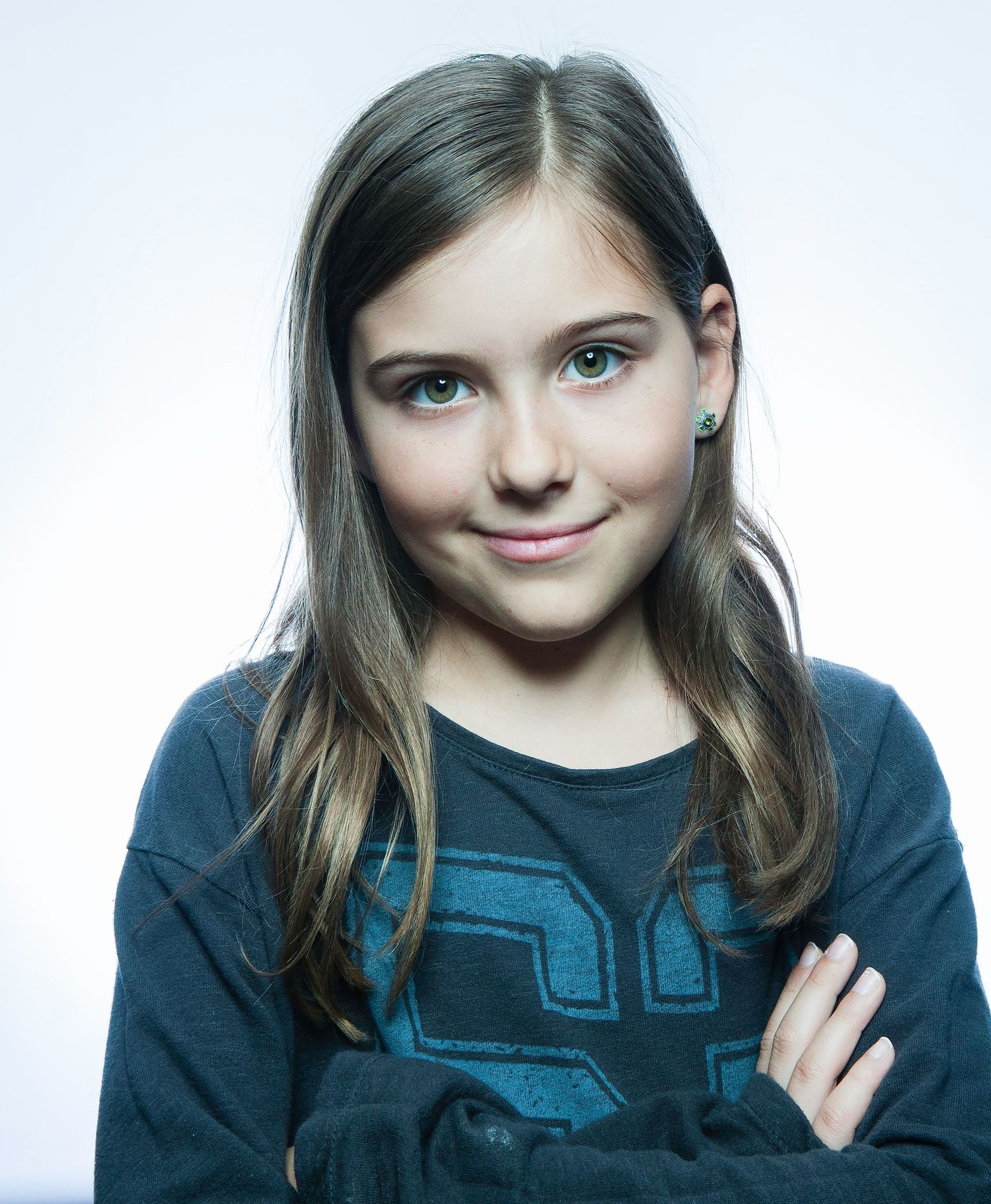 A smiling figure in a dark blue sweater shown in four similar poses against a light background.