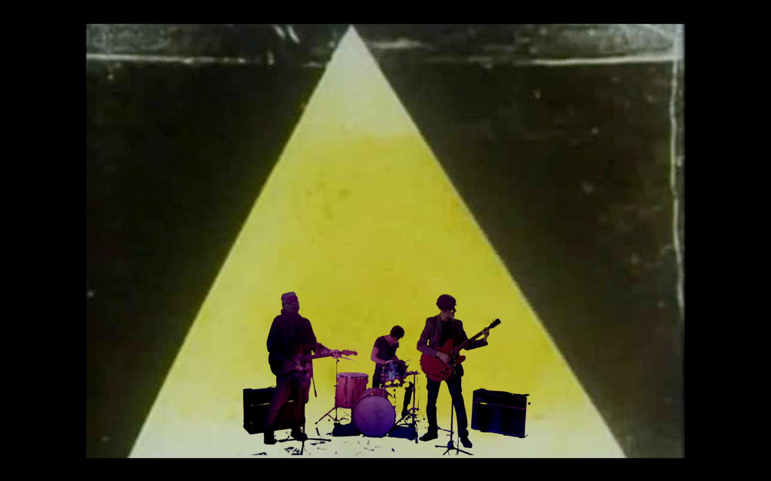 Silhouetted band members performing against a bright triangular light backdrop.