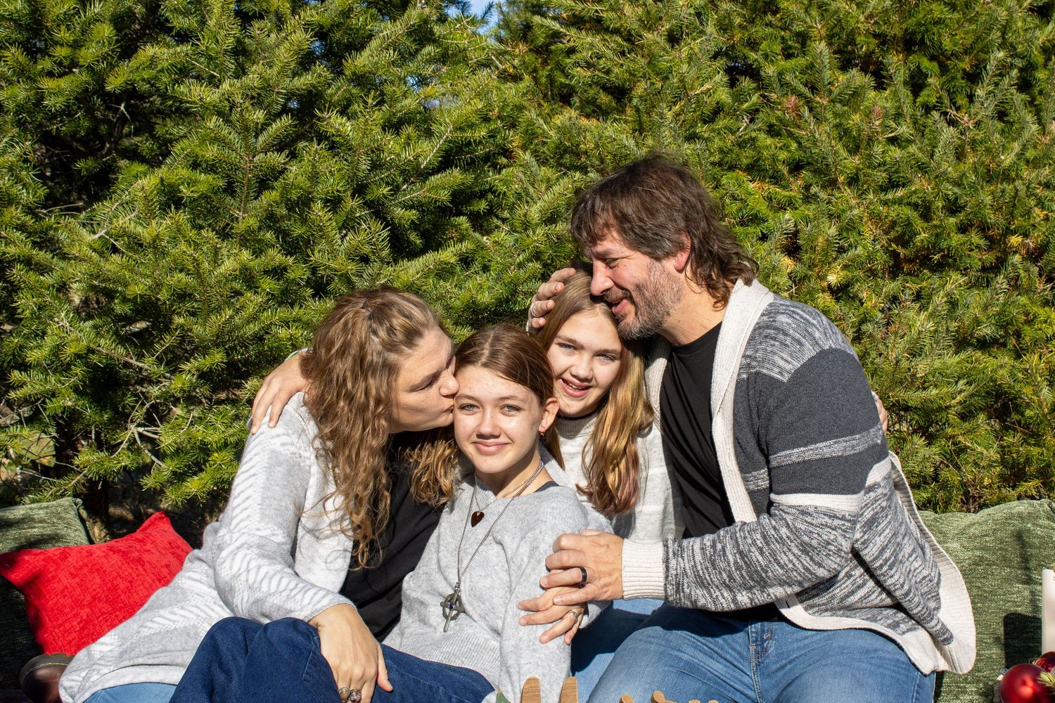 Pine trees provide a natural backdrop for a festive outdoor gathering.