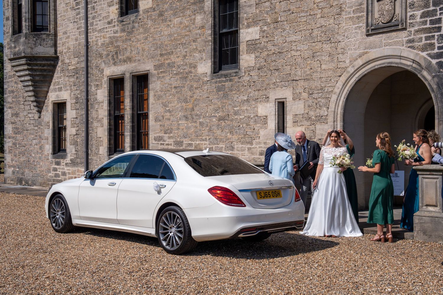 wedding car at Barnbougle castle with bride and family