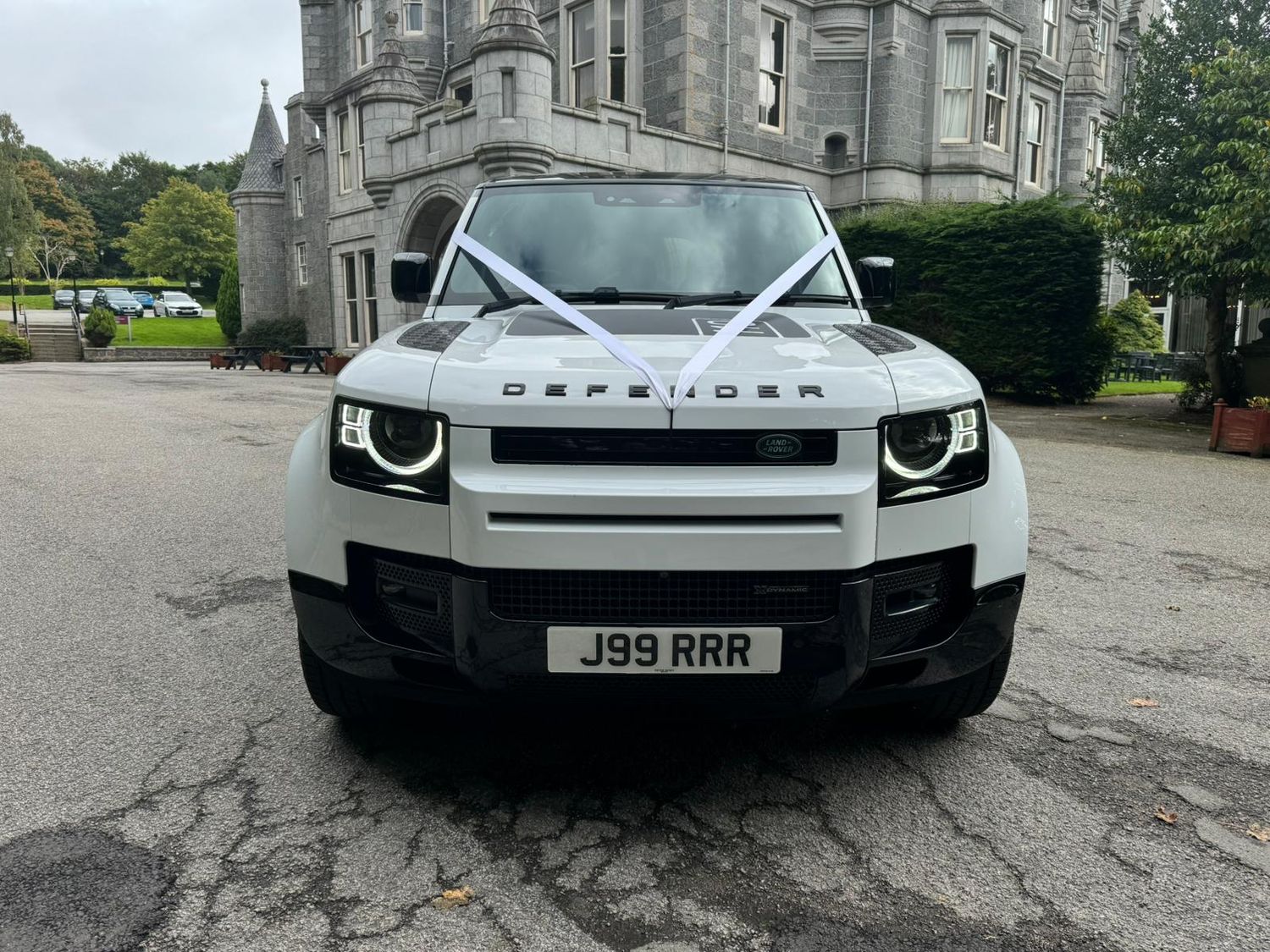 Range Rover Defender with white ribbon